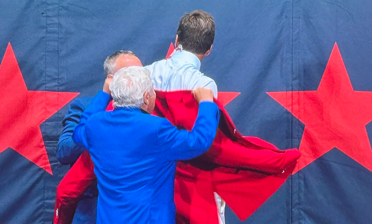 Tom Brady receives his red Patriots Hall of Fame coat on Wednesday night