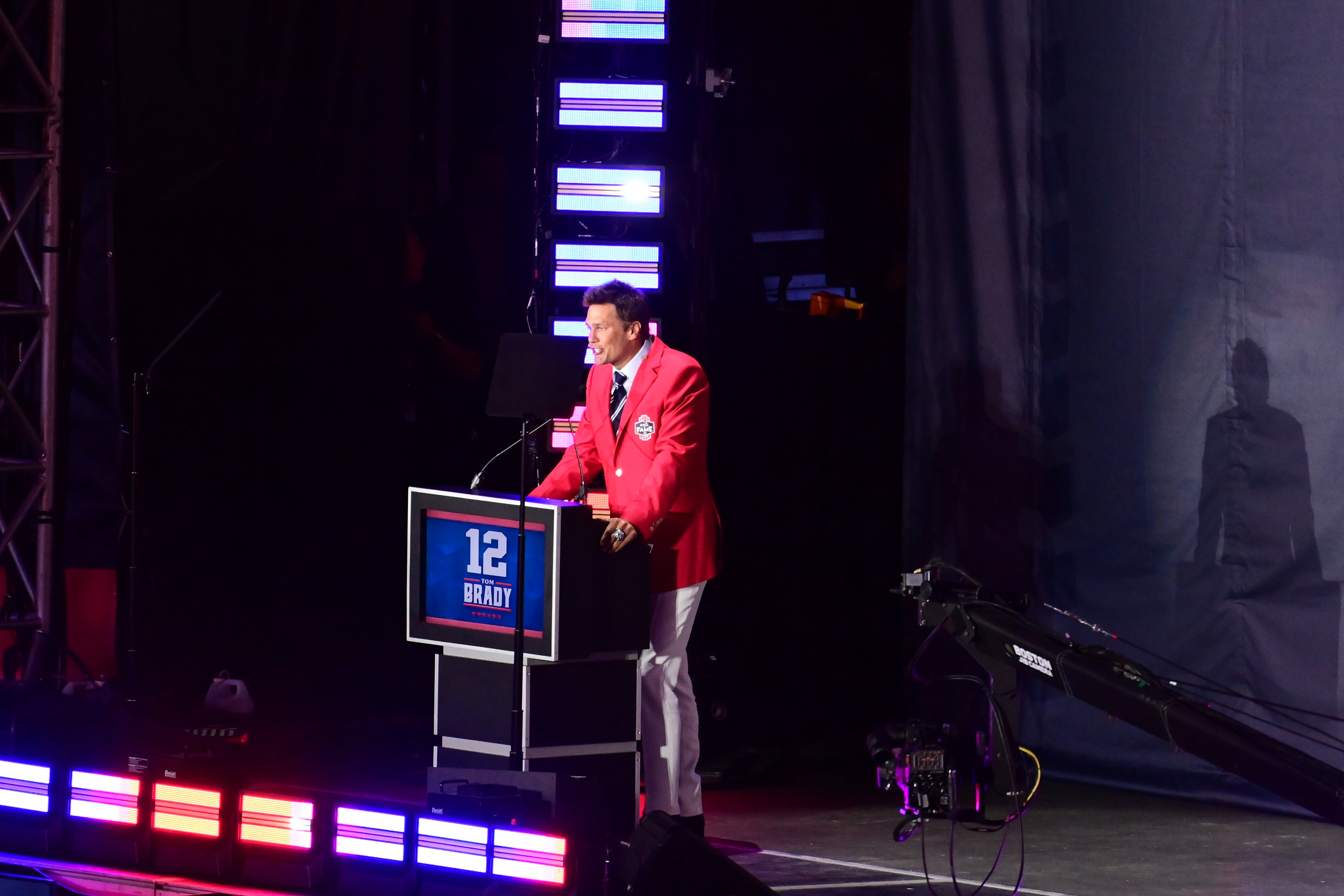 Jun 12, 2024; Foxborough, MA, USA; Former quarterback Tom Brady speaks during his New England Patriots Hall of Fame induction ceremony at Gillette Stadium.