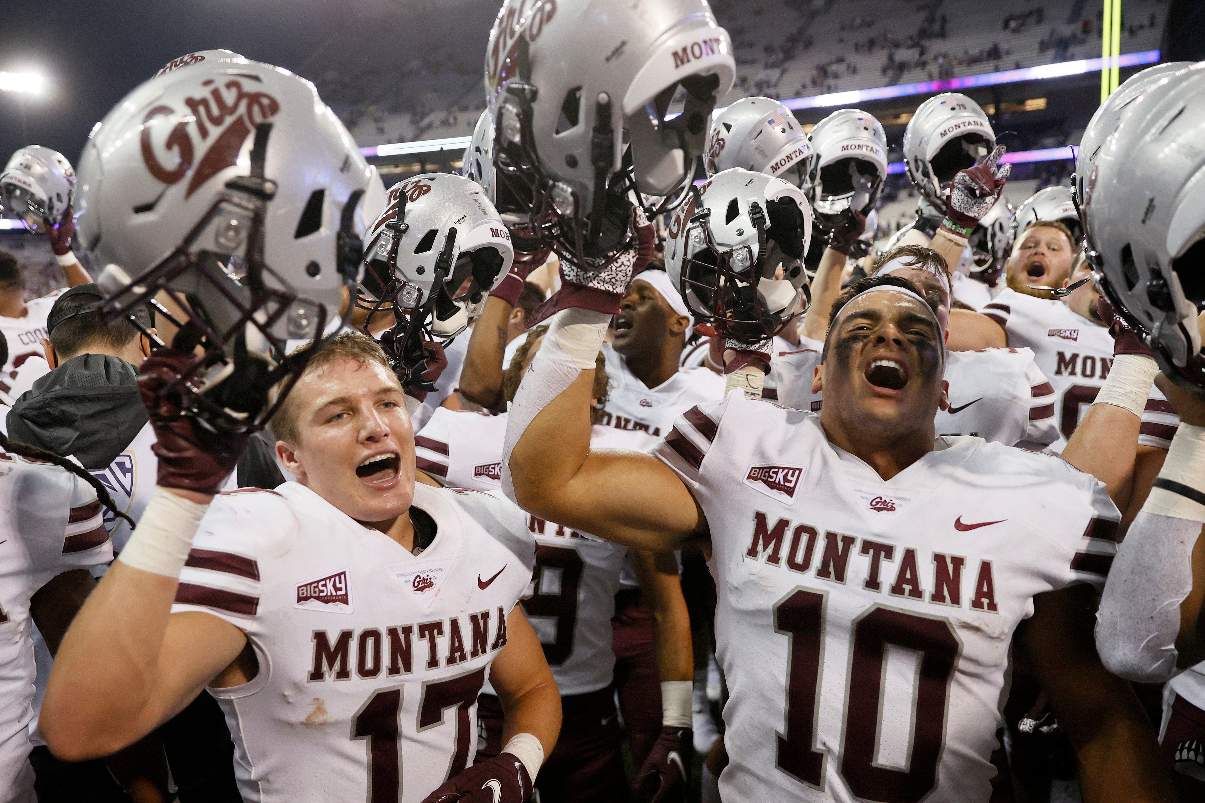 SEATTLE, WASHINGTON - SEPTEMBER 04: Robby Hauck #17 and Marcus Welnel #10 of the Montana Grizzlies celebrate their 13-7 win against the Washington Huskies at Husky Stadium on September 04, 2021 in Seattle, Washington.