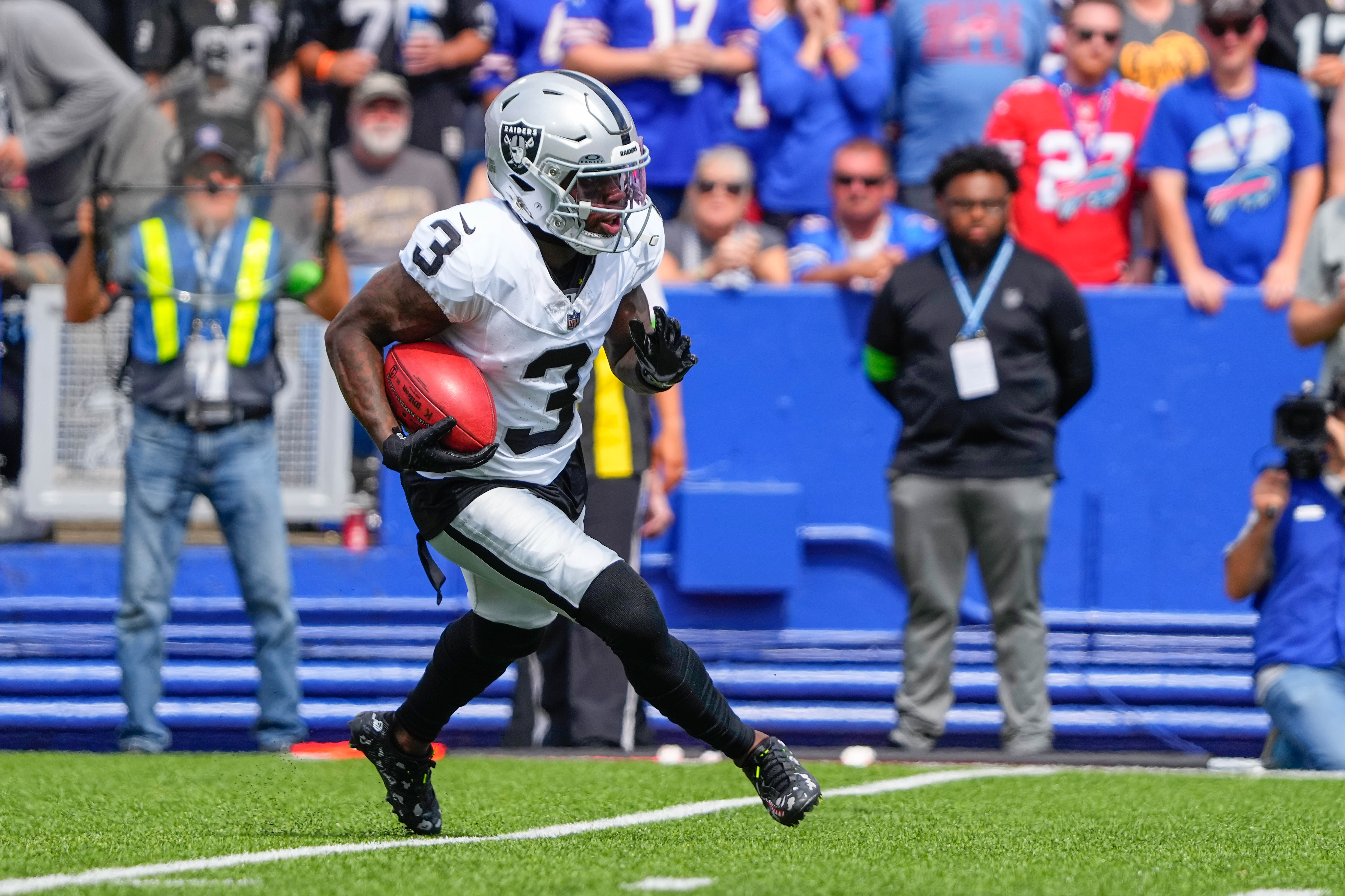 Sep 17, 2023; Orchard Park, New York, USA; Las Vegas Raiders wide receiver DeAndre Carter (3) returns a kick off against the Buffalo Bills during the first half at Highmark Stadium.