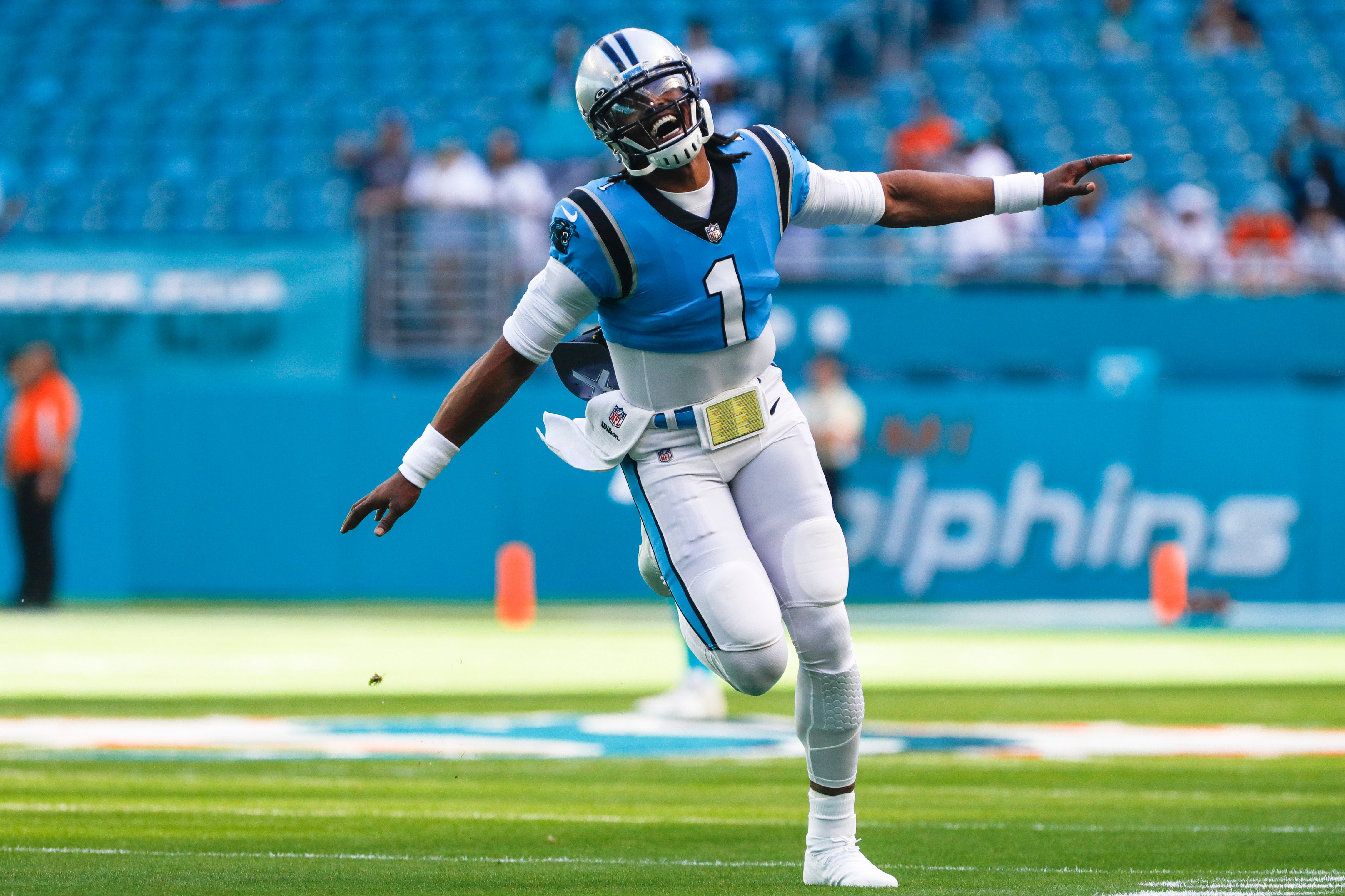 Nov 28, 2021; Miami Gardens, Florida, USA; Carolina Panthers quarterback Cam Newton (1) takes on the field prior the game against the Miami Dolphins at Hard Rock Stadium. Mandatory Credit: Sam Navarro-USA TODAY Sports