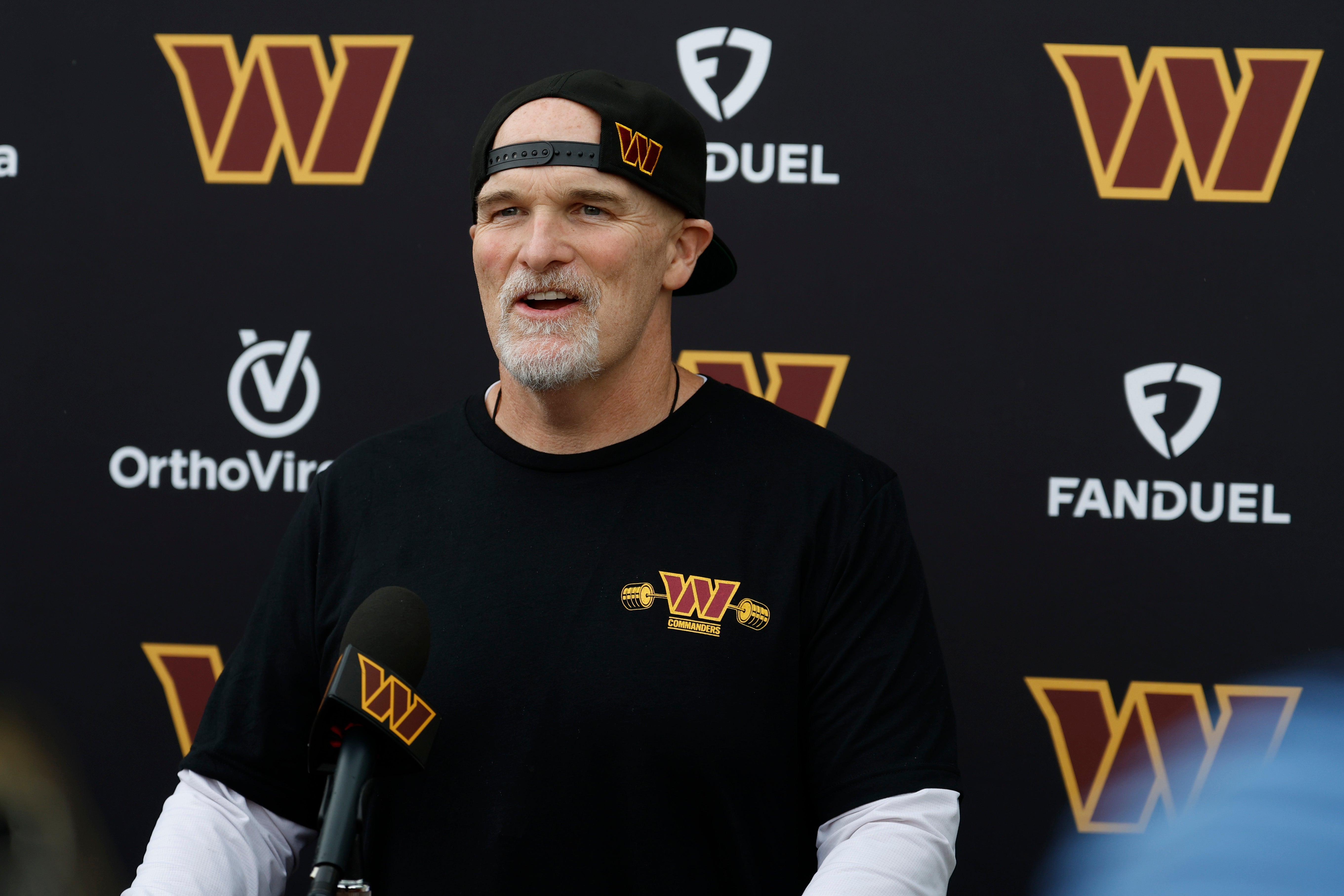 Jun 5, 2024; Ashburn, VA, USA; Washington Commanders head coach Dan Quinn speaks with the media prior to an OTA workout at Commanders Park.