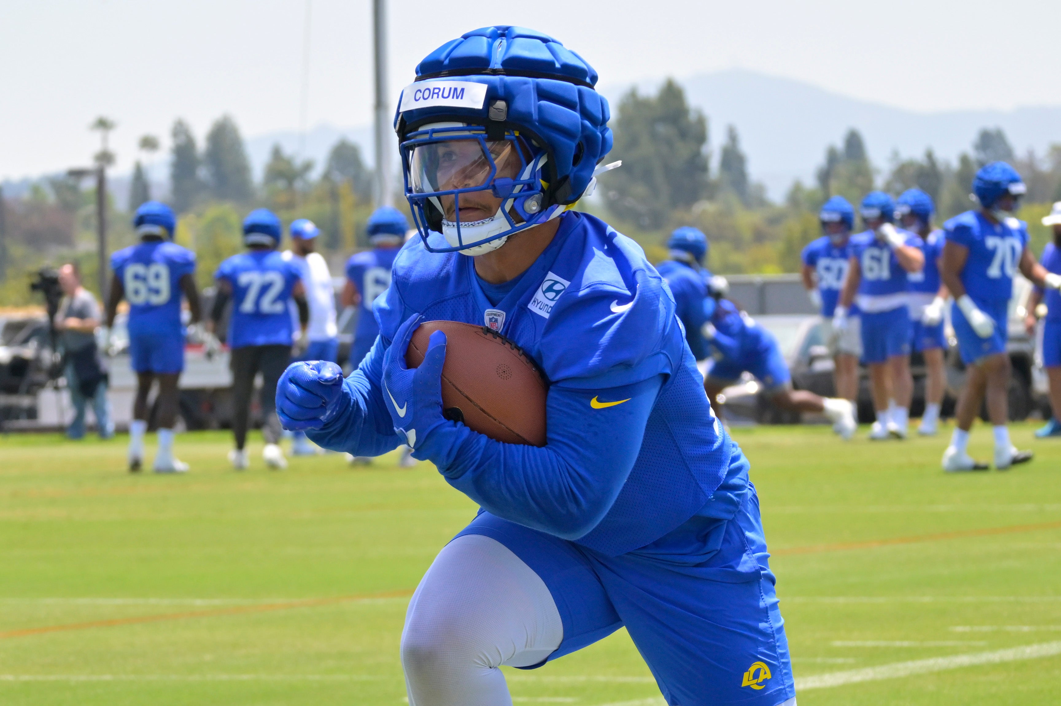May 28, 2024; Thousand Oaks, CA, USA; Los Angeles Rams running back Blake Corum (22) participates in drills during OTAs at the team training facility at California Lutheran University. Mandatory Credit: Jayne Kamin-Oncea-USA TODAY Sports