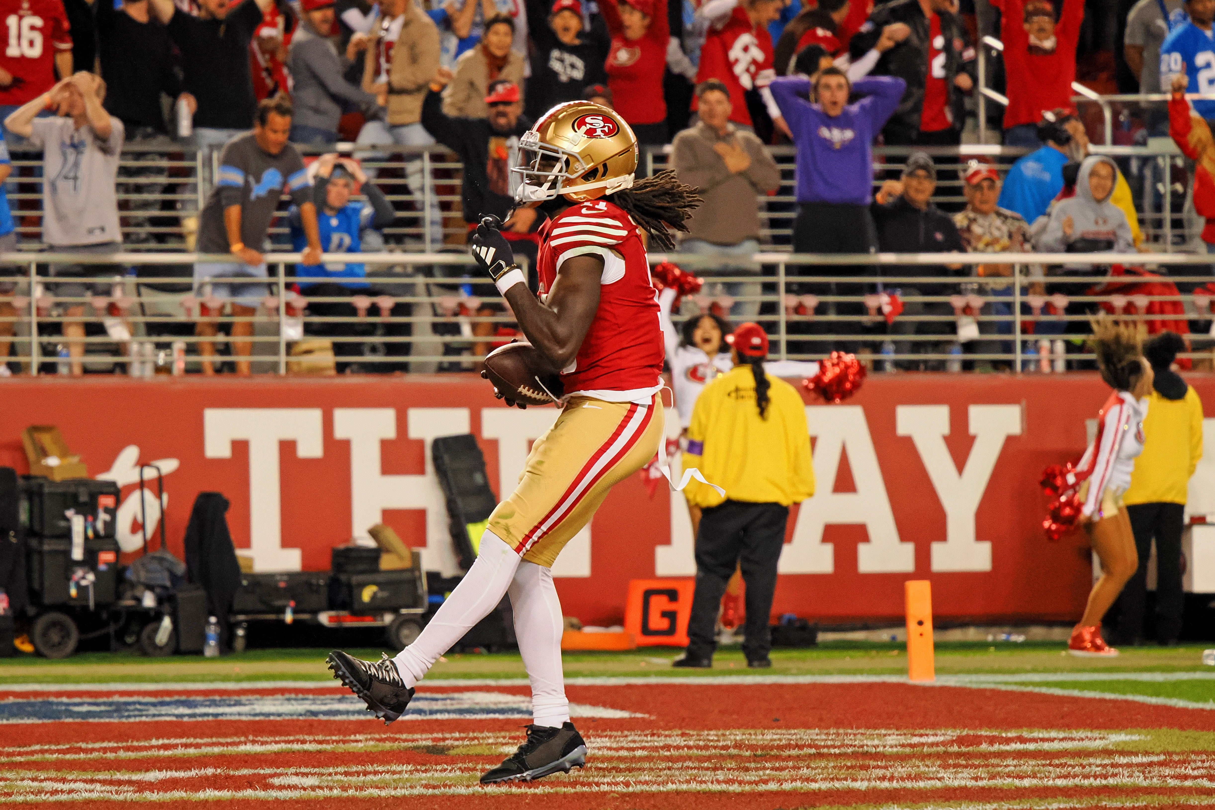 Jan 28, 2024; Santa Clara, California, USA; San Francisco 49ers wide receiver Brandon Aiyuk (11) reacts after catching a ball that bounced off the face mask of Detroit Lions cornerback Kindle Vildor (not pictured) during the second half of the NFC Championship football game at Levi's Stadium.