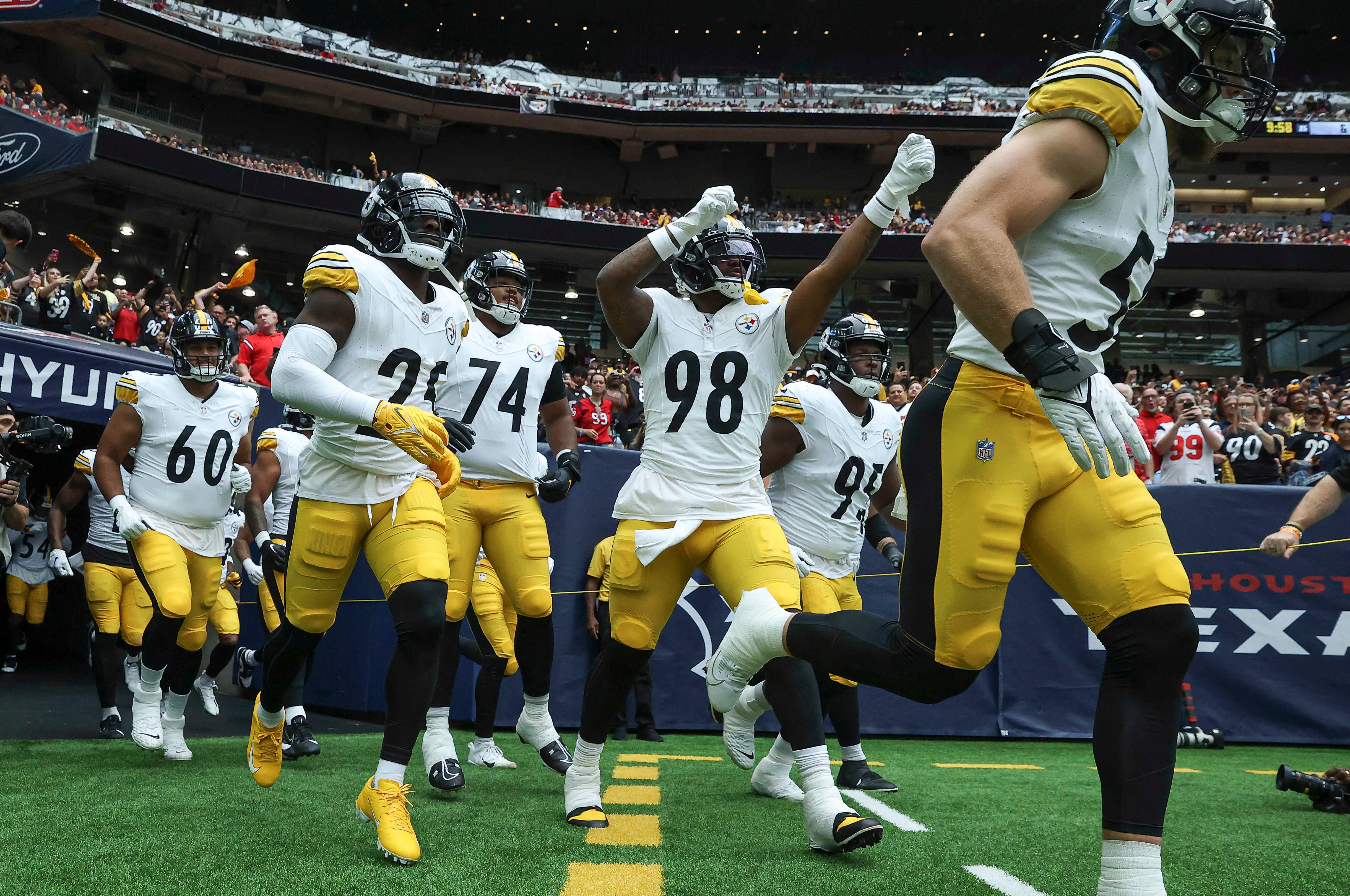 Oct 1, 2023; Houston, Texas, USA; Pittsburgh Steelers defensive end DeMarvin Leal (98) and teammates run onto the field before the game against the Houston Texans at NRG Stadium. Mandatory Credit: Troy Taormina-USA TODAY Sports