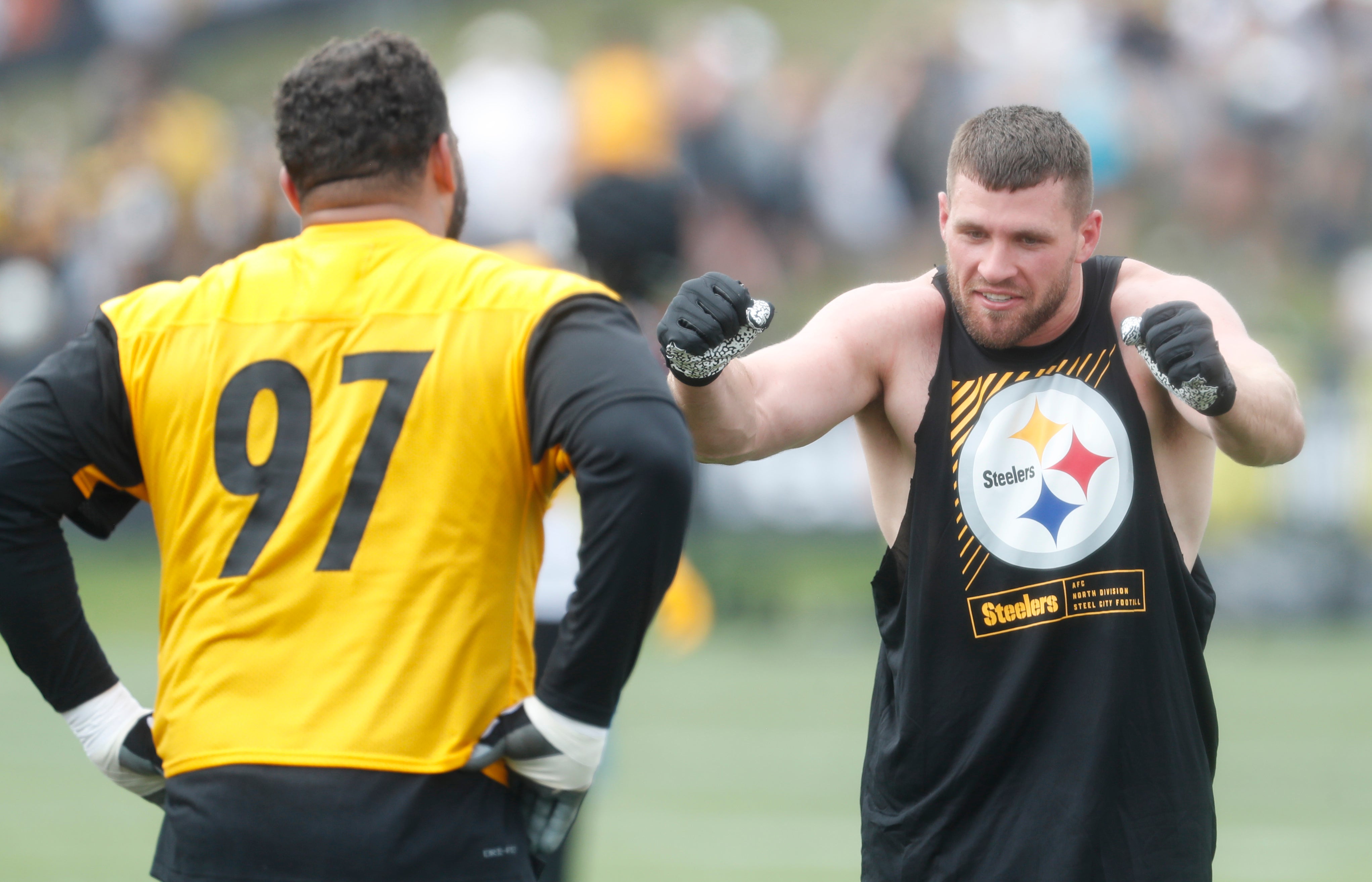 Jul 27, 2023; Latrobe, PA, USA; Pittsburgh Steelers defensive tackle Cameron Heyward (97) and linebacker T.J. Watt (right) participate in drills during training camp at Saint Vincent College. Mandatory Credit: Charles LeClaire-USA TODAY Sports