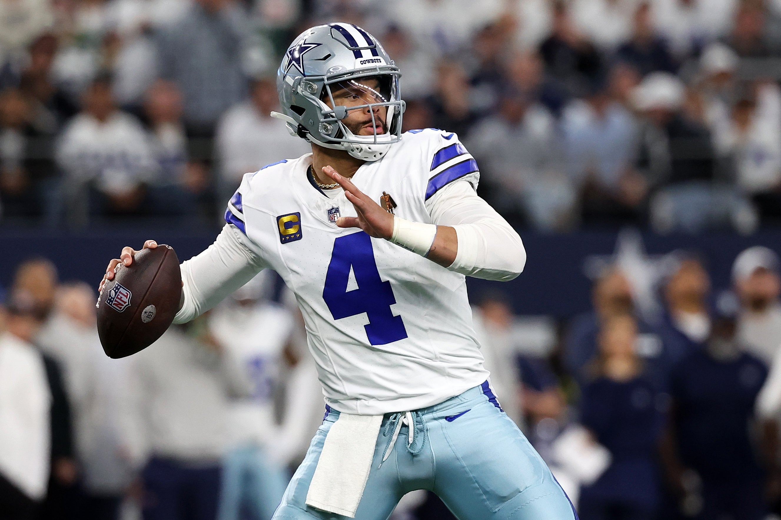 Dallas Cowboys quarterback Dak Prescott (4) drops back to pass against the Green Bay Packers in the first half of the 2024 NFC wild card game at AT&T Stadium.