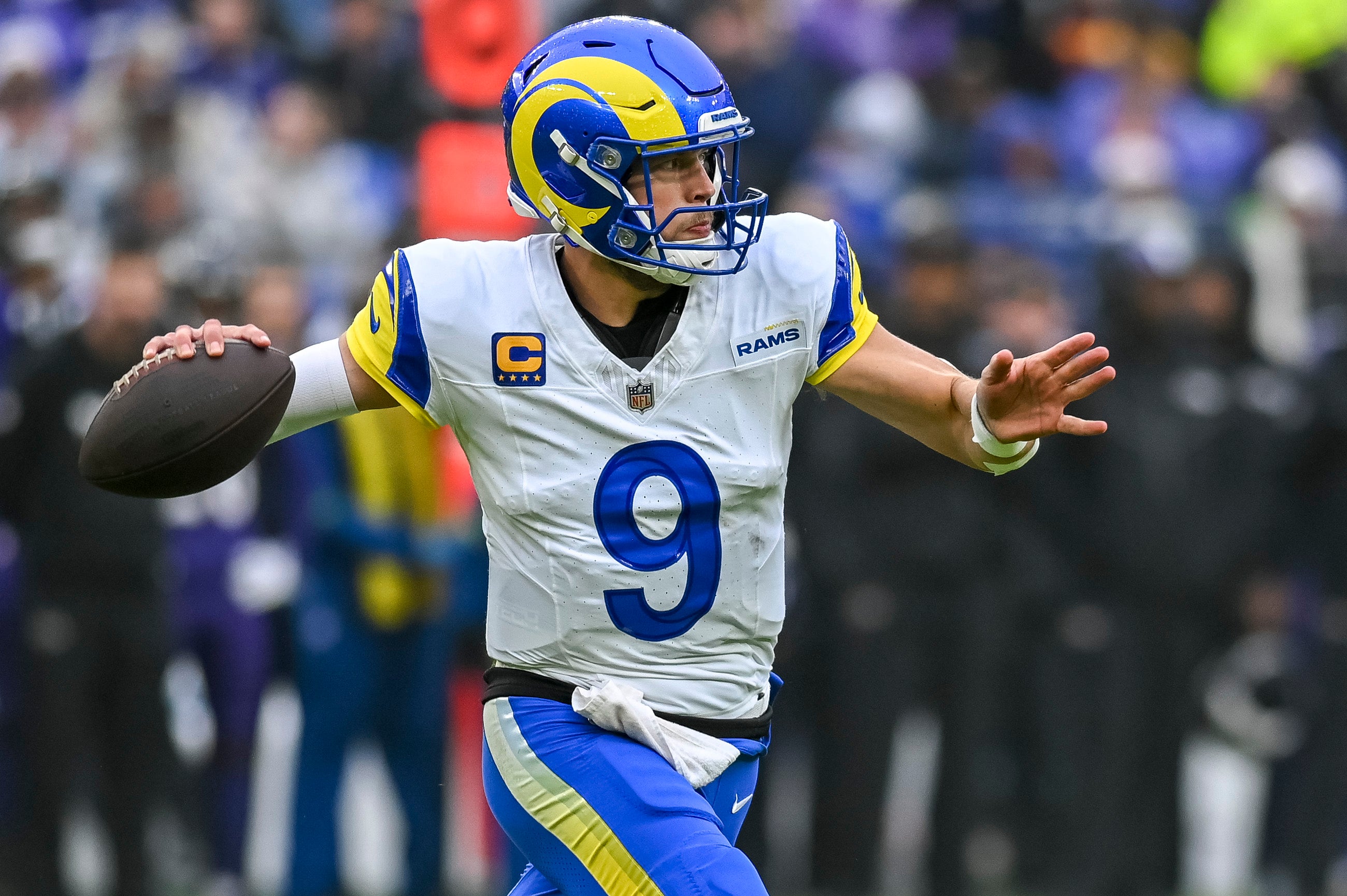 Dec 10, 2023; Baltimore, Maryland, USA; Los Angeles Rams quarterback Matthew Stafford (9) throws on the run during the first half against the Baltimore Ravens at M&T Bank Stadium. Mandatory Credit: Tommy Gilligan-USA TODAY Sports