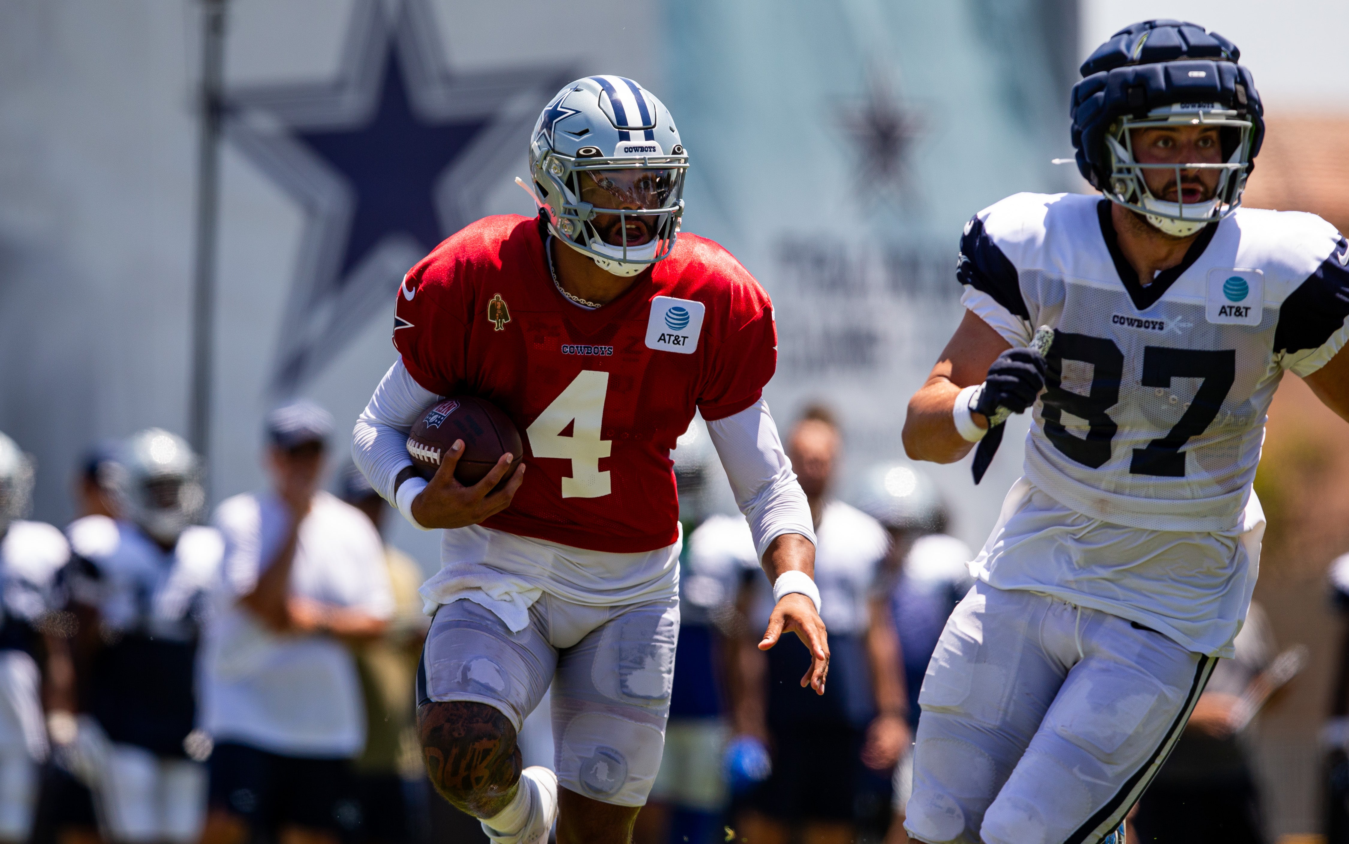 Dallas Cowboys quarterback Dak Prescott (4) scrambles during training camp at Marriott Residence Inn-River Ridge playing fields.