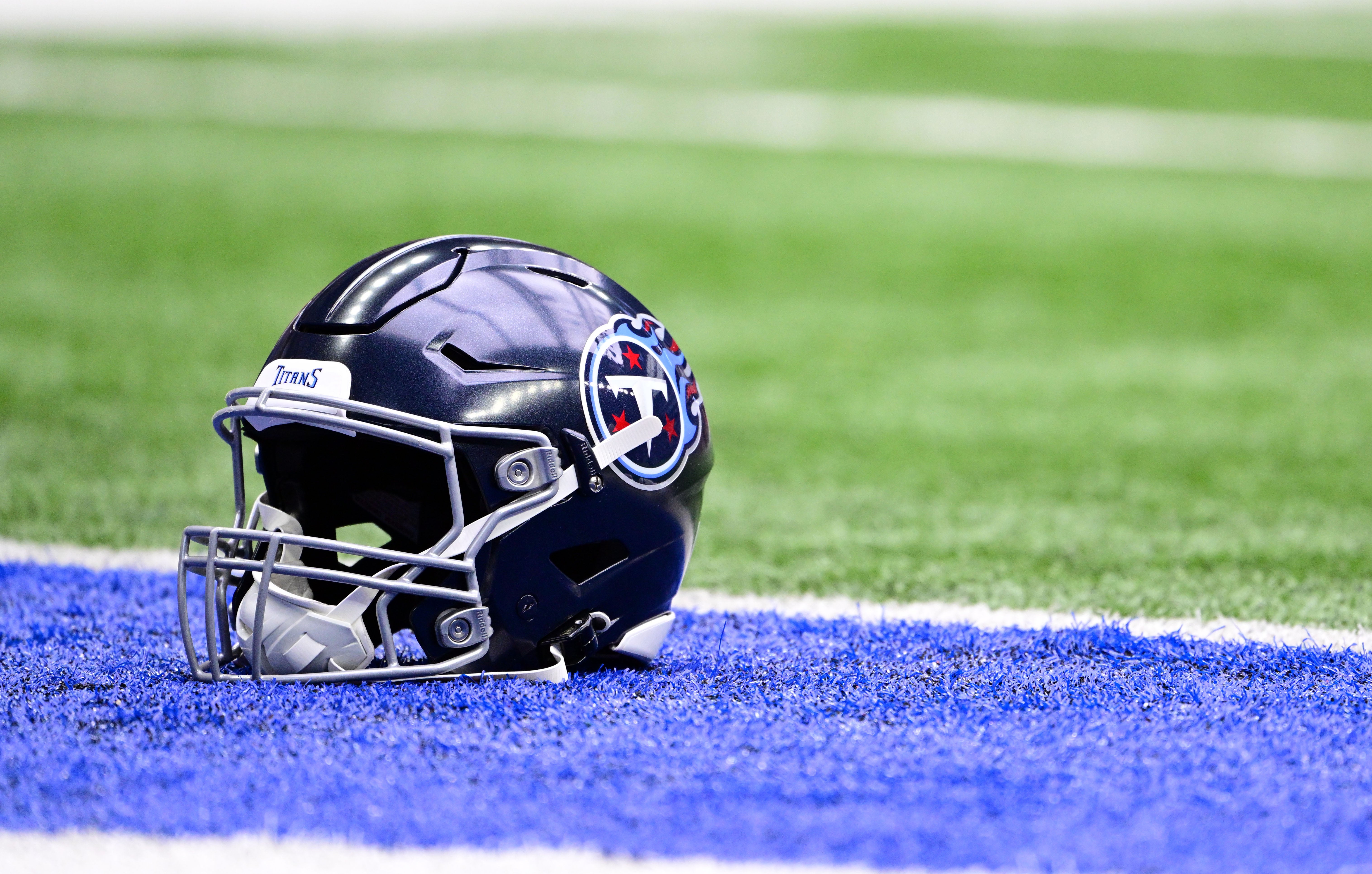 A Tennessee Titans helmet sits in the end zone before the game against the Indianapolis Colts at Lucas Oil Stadium. Marc Lebryk-USA TODAY Sports 