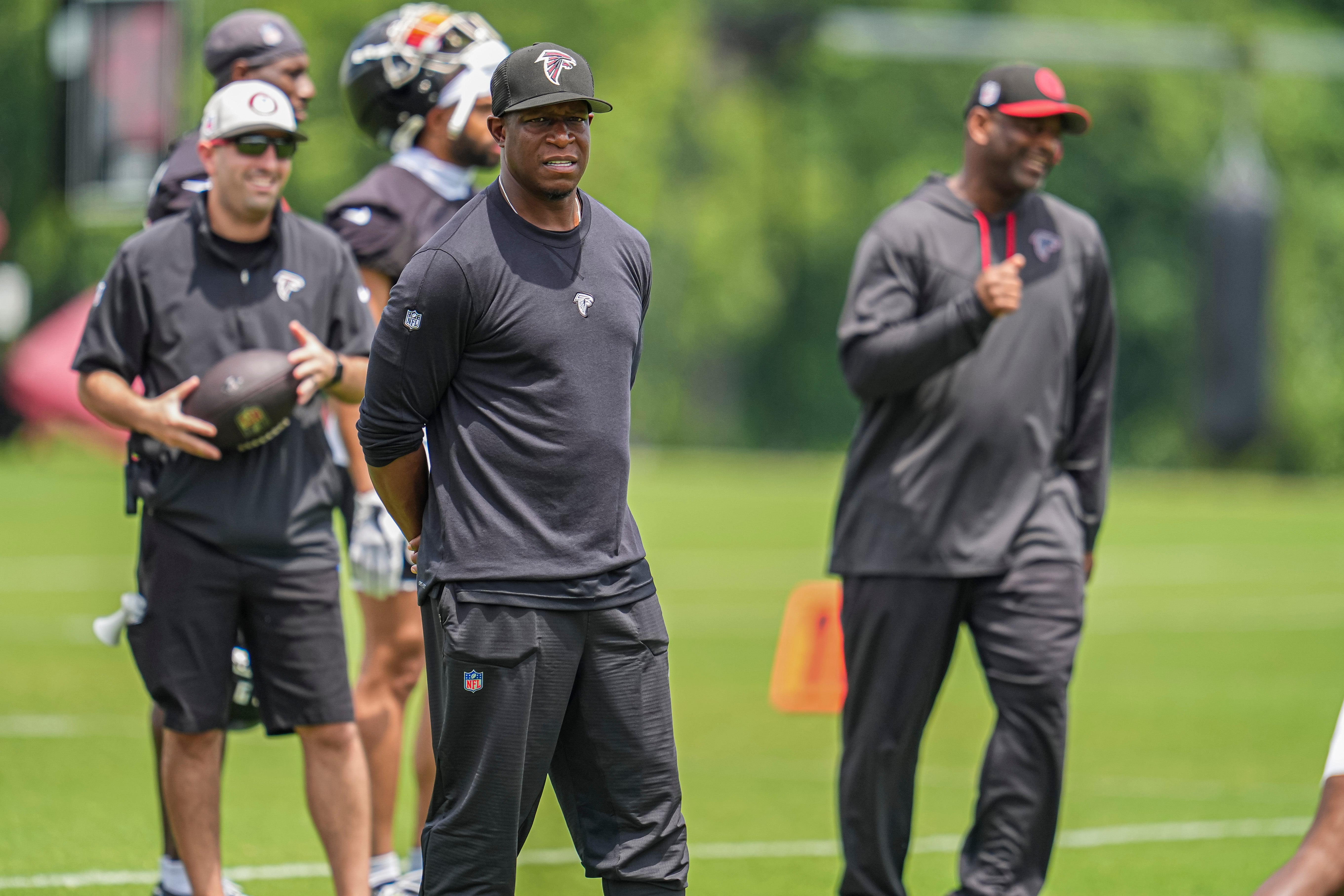 Atlanta Falcons head coach Raheem Morris watches the action on the field during Falcons OTA at the Falcons Training facility.