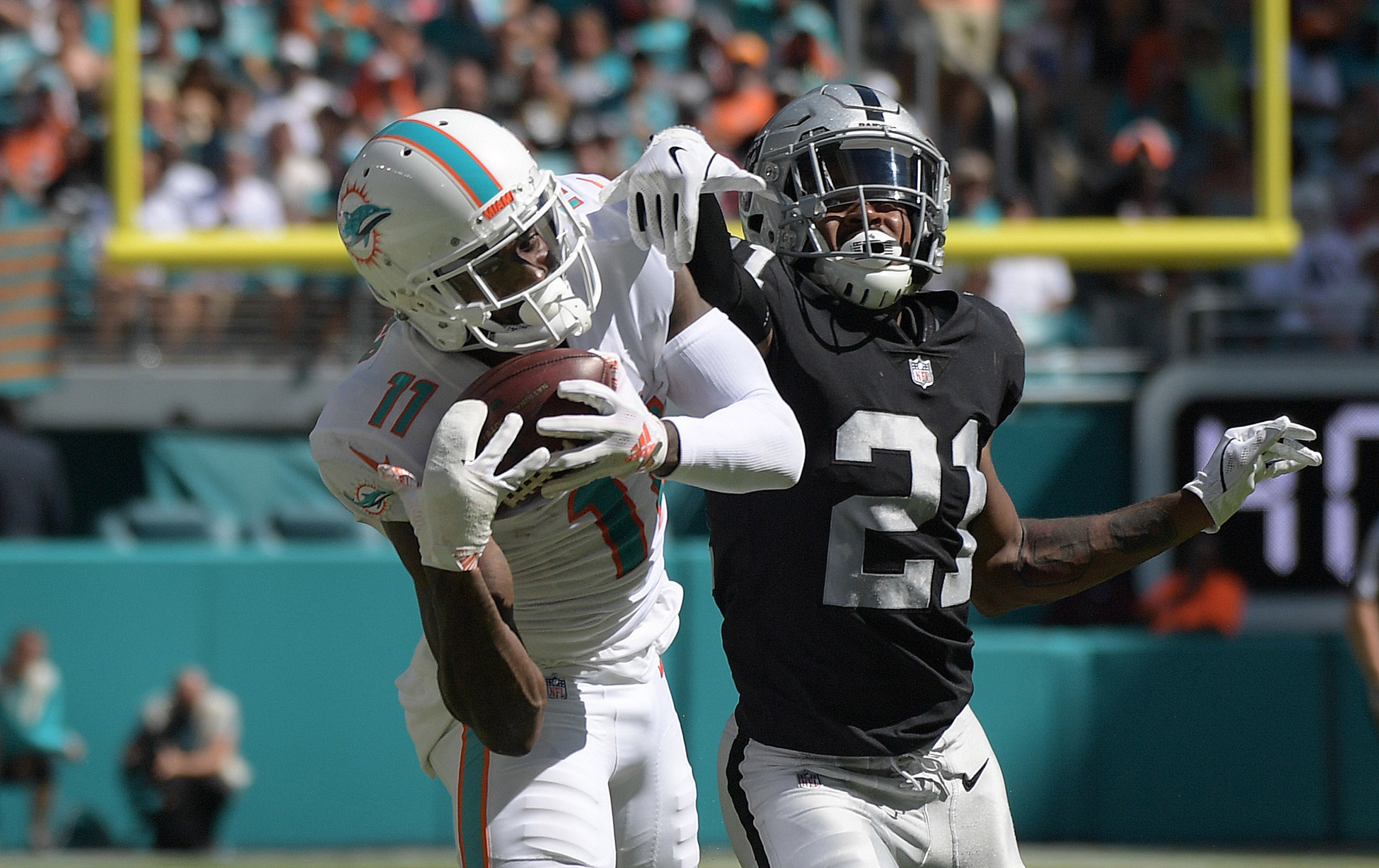 Miami Dolphins wide receiver DeVante Parker (11) is defended by Oakland Raiders cornerback Gareon Conley (21) at Hard Rock Stadium. The Dolphins defeated the Raiders 28-20.