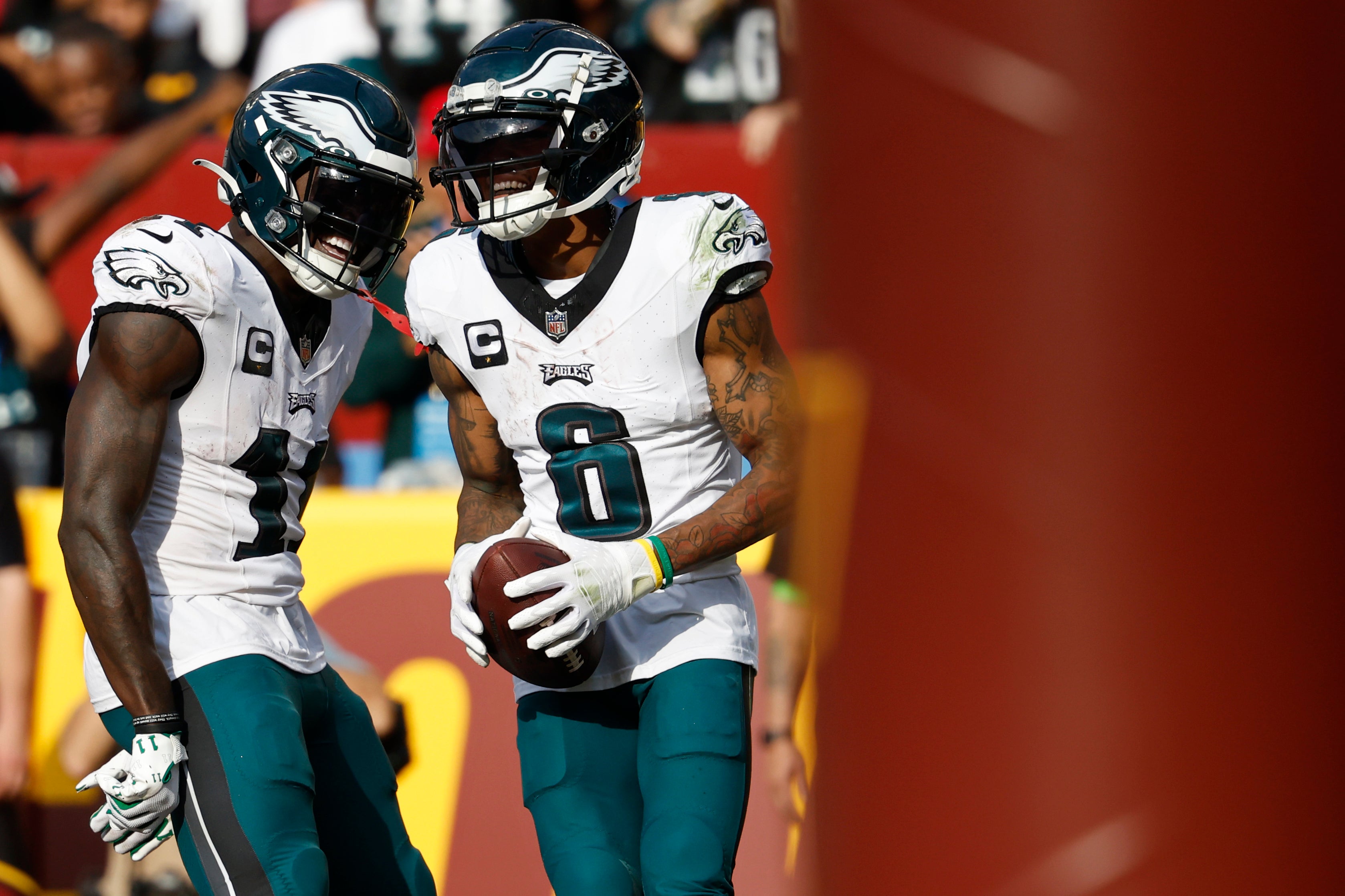 Philadelphia Eagles wide receiver DeVonta Smith (6) celebrates with Eagles wide receiver A.J. Brown (11) after catching a touchdown pass against the Washington Commanders during the fourth quarter.