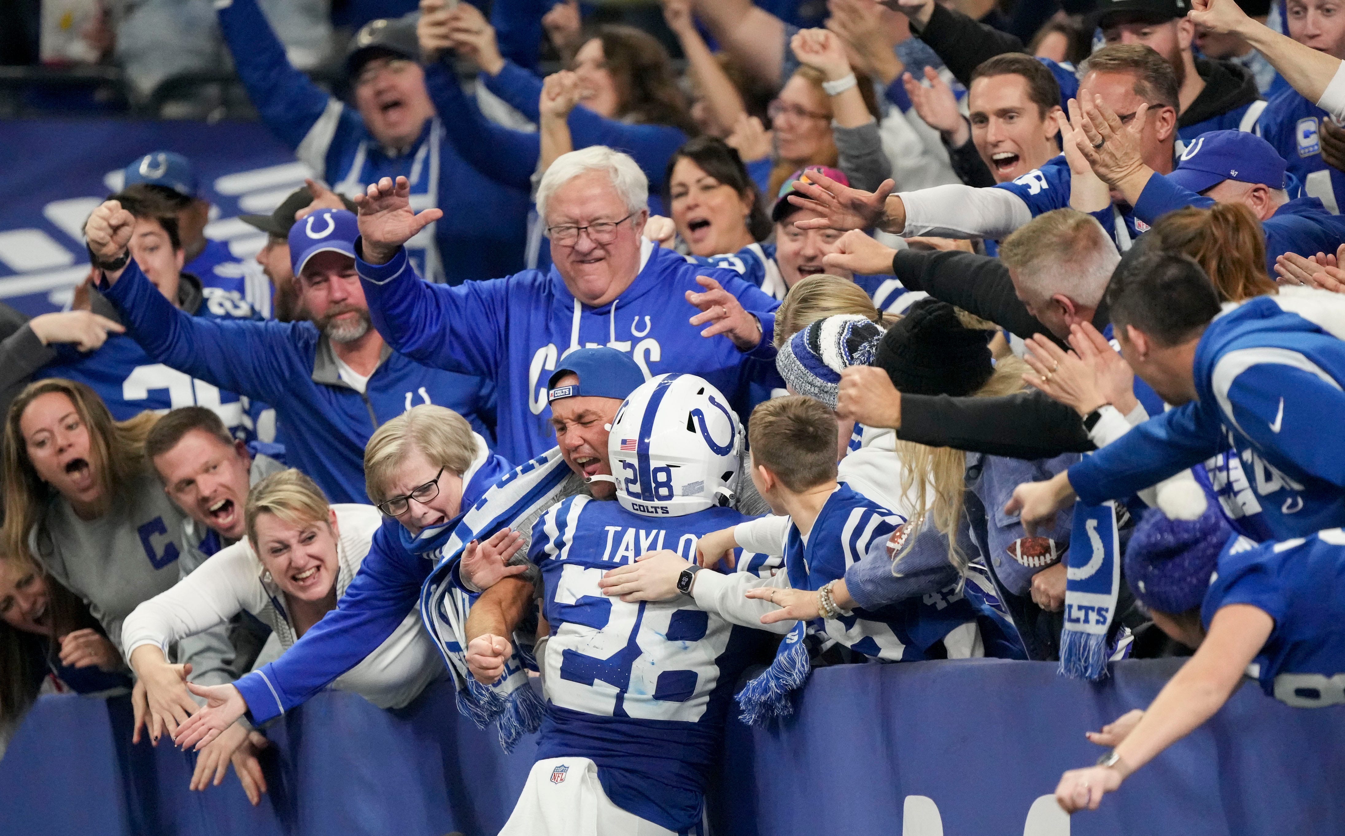 Indianapolis Colts running back Jonathan Taylor (28) celebrates with fans after rushing for a touchdown Saturday, Jan. 6, 2024, during a game against the Houston Texans at Lucas Oil Stadium in Indianapolis.