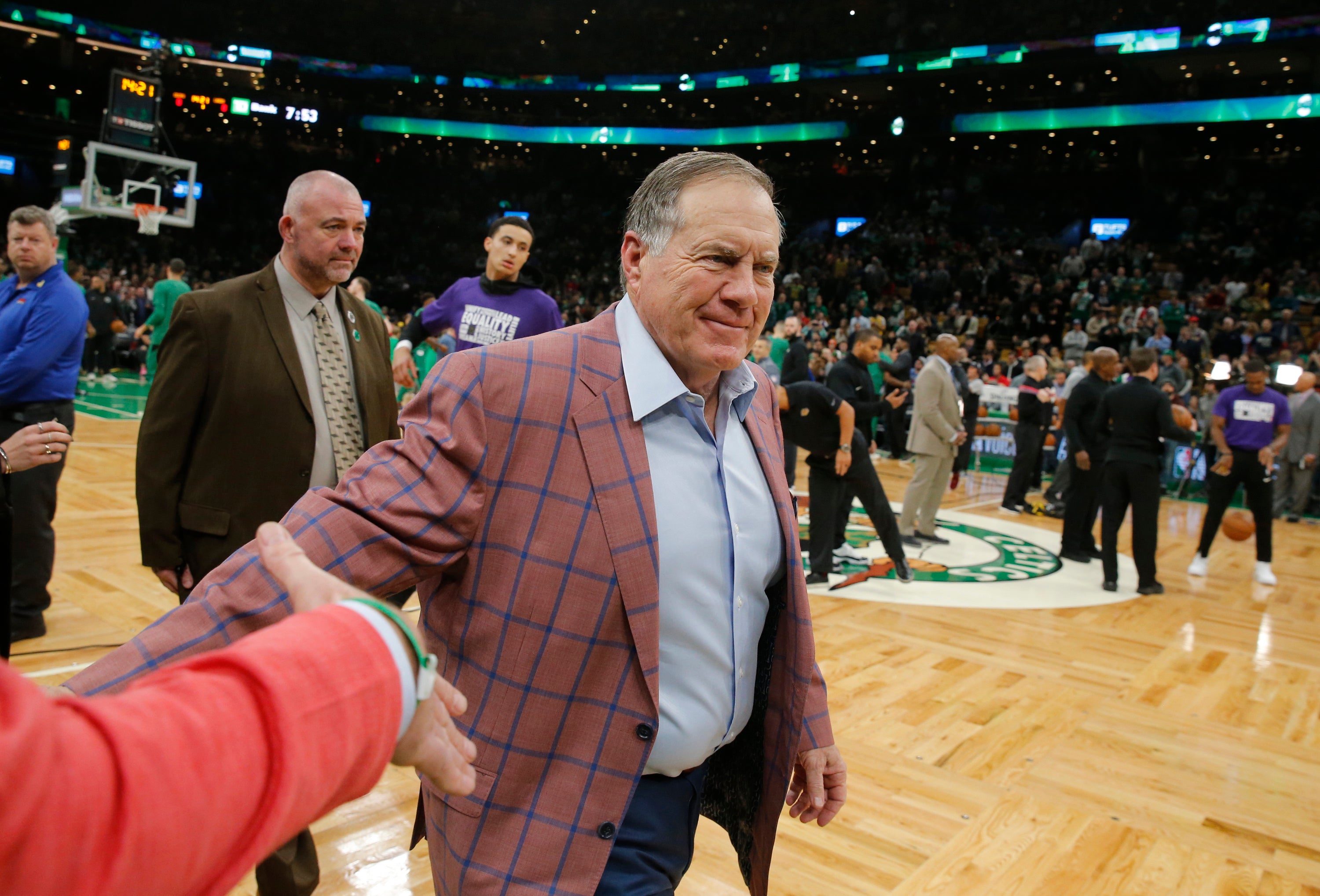Feb 7, 2019; Boston, MA, USA; New England Patriots head coach Bill Belichick walks to his seat before the start of a game between the Boston Celtics and Los Angeles Lakers at TD Garden.