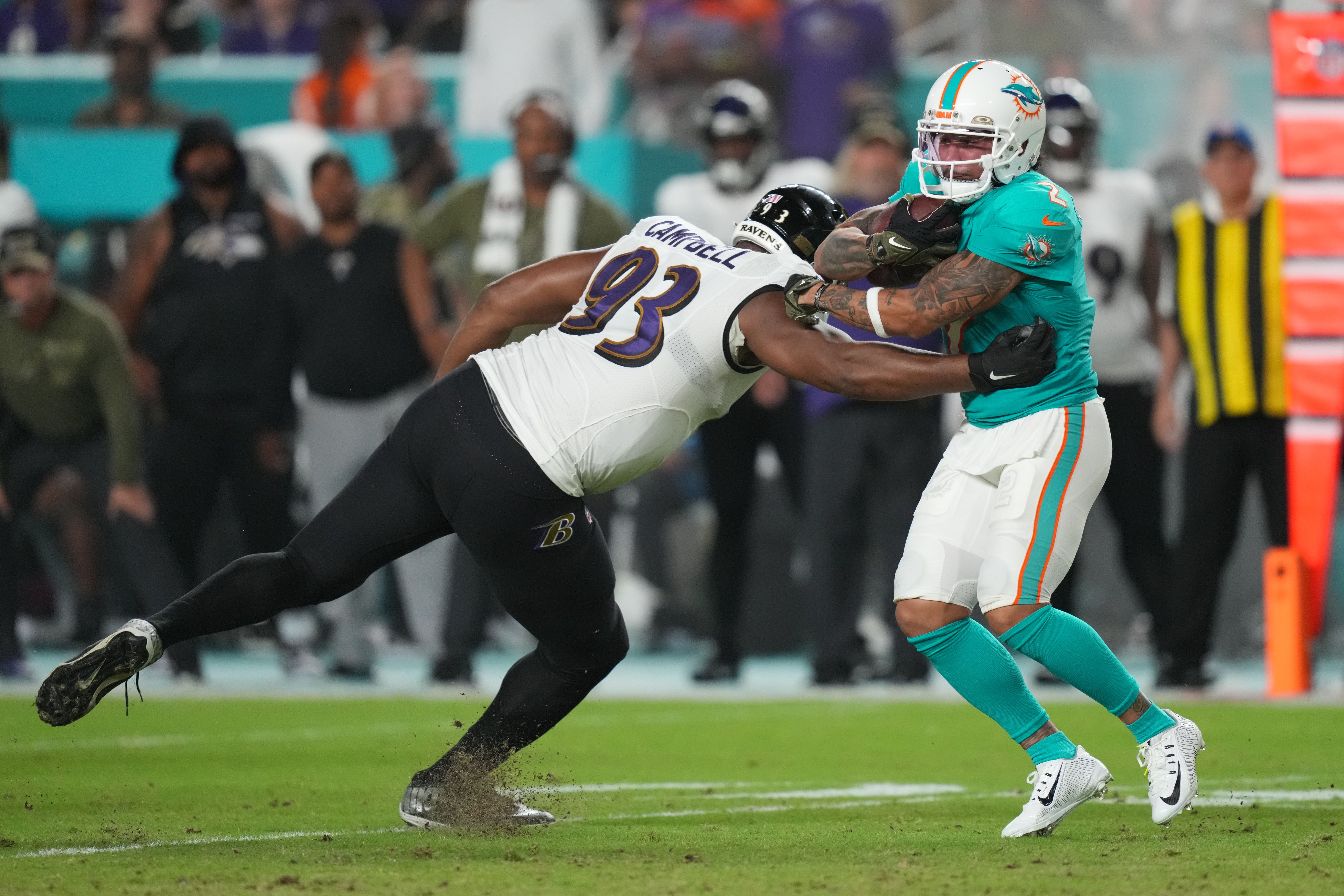 Nov 11, 2021; Miami Gardens, Florida, USA; Miami Dolphins wide receiver Albert Wilson (2) breaks the tackle of Baltimore Ravens defensive end Calais Campbell (93) during the first half at Hard Rock Stadium. 