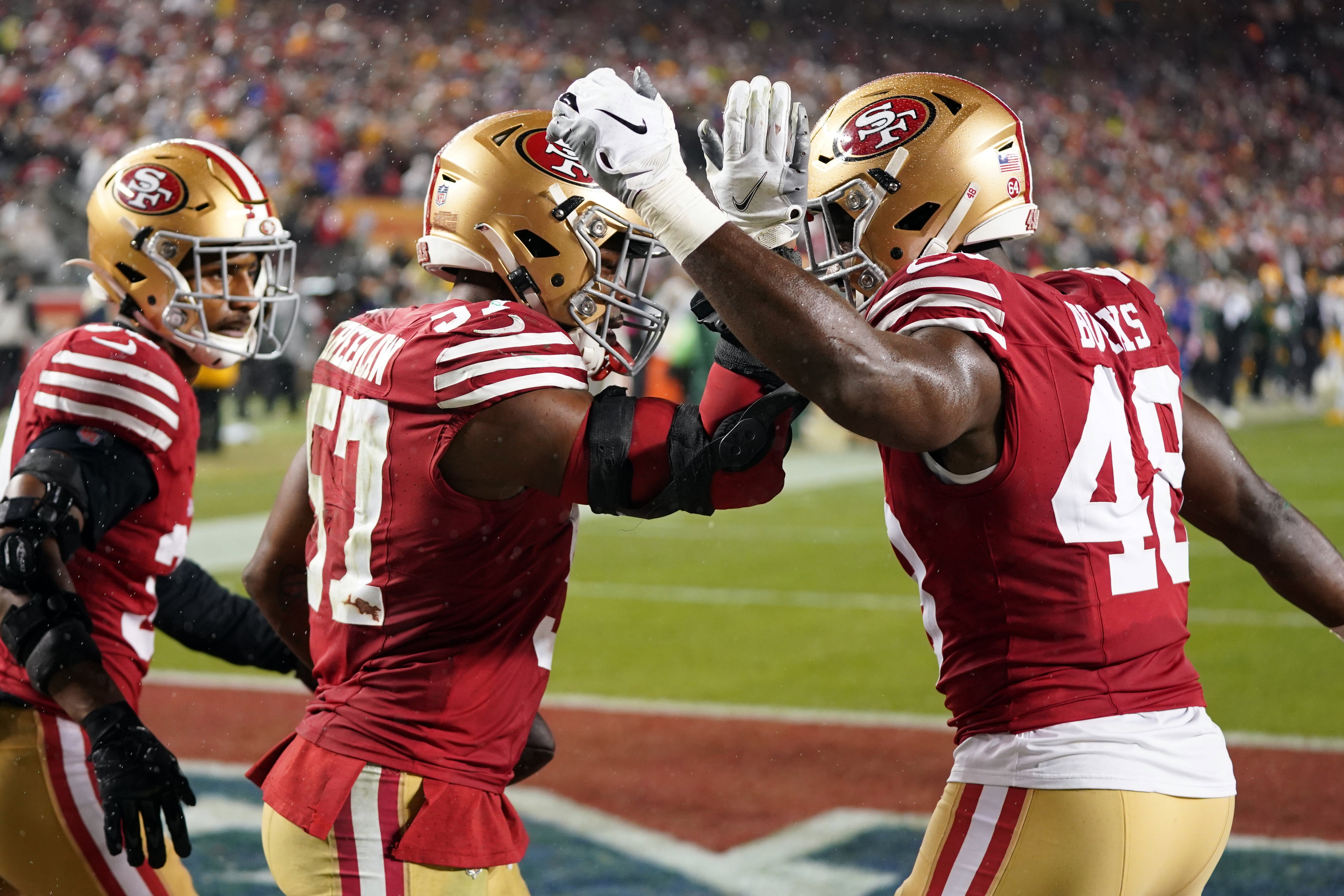 January 20, 2024; Santa Clara, CA, USA; San Francisco 49ers linebacker Dre Greenlaw (57) and linebacker Oren Burks (48) celebrate after a play against the Green Bay Packers during the fourth quarter in a 2024 NFC divisional round game at Levi's Stadium