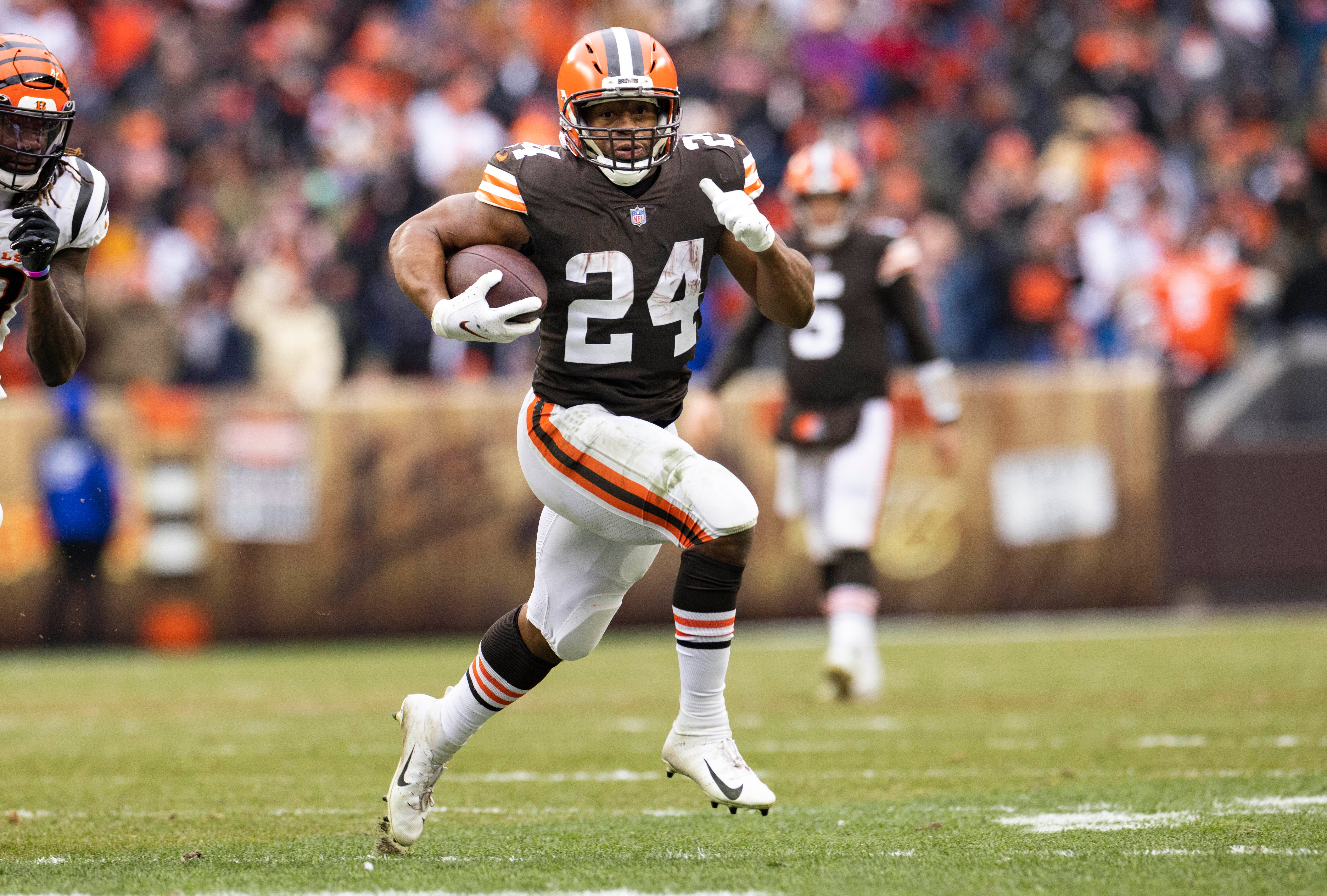 Jan 9, 2022; Cleveland, Ohio, USA; Cleveland Browns running back Nick Chubb (24) runs the ball against the Cincinnati Bengals during the third quarter at FirstEnergy Stadium. Mandatory Credit: Scott Galvin-USA TODAY Sports
