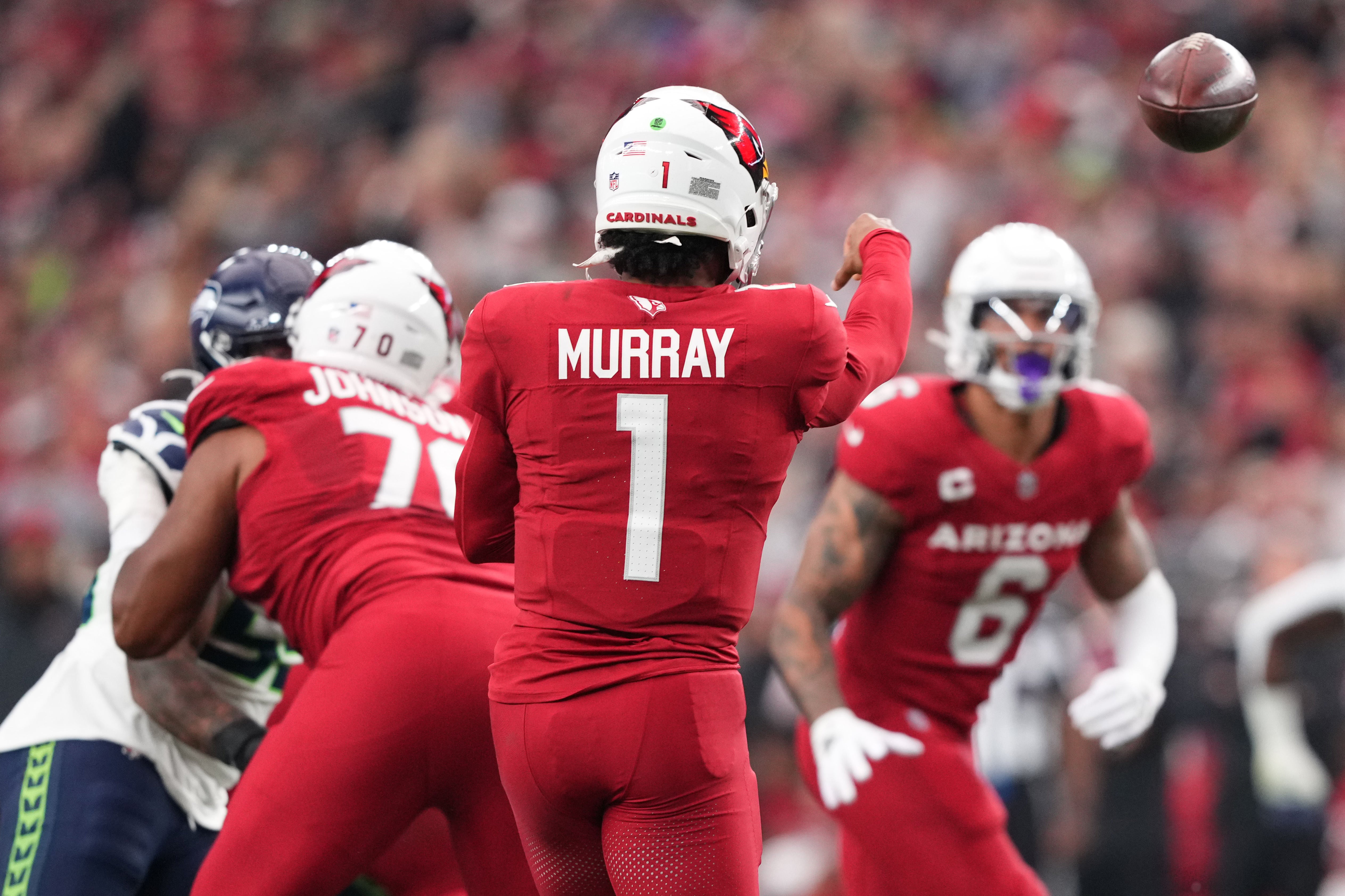 Jan 7, 2024; Glendale, Arizona, USA; Arizona Cardinals quarterback Kyler Murray (1) throws to Arizona Cardinals running back James Conner (6) during the first half against the Seattle Seahawks at State Farm Stadium. Mandatory Credit: Joe Camporeale-USA TODAY Sports