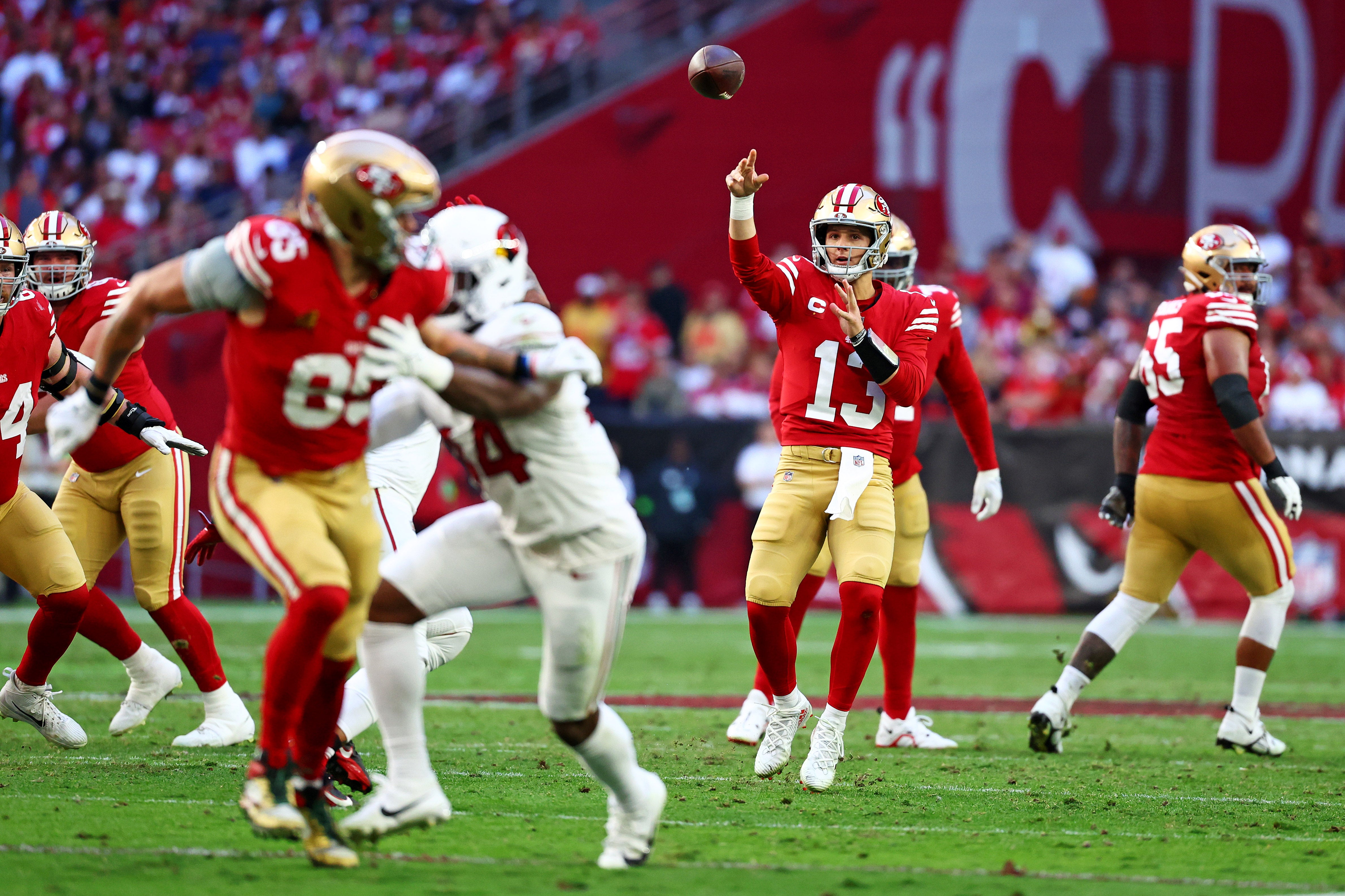 Dec 17, 2023; Glendale, Arizona, USA; San Francisco 49ers quarterback Brock Purdy (13) throws a pass to tight end George Kittle (85) during the first half against the San Francisco 49ers at State Farm Stadium.