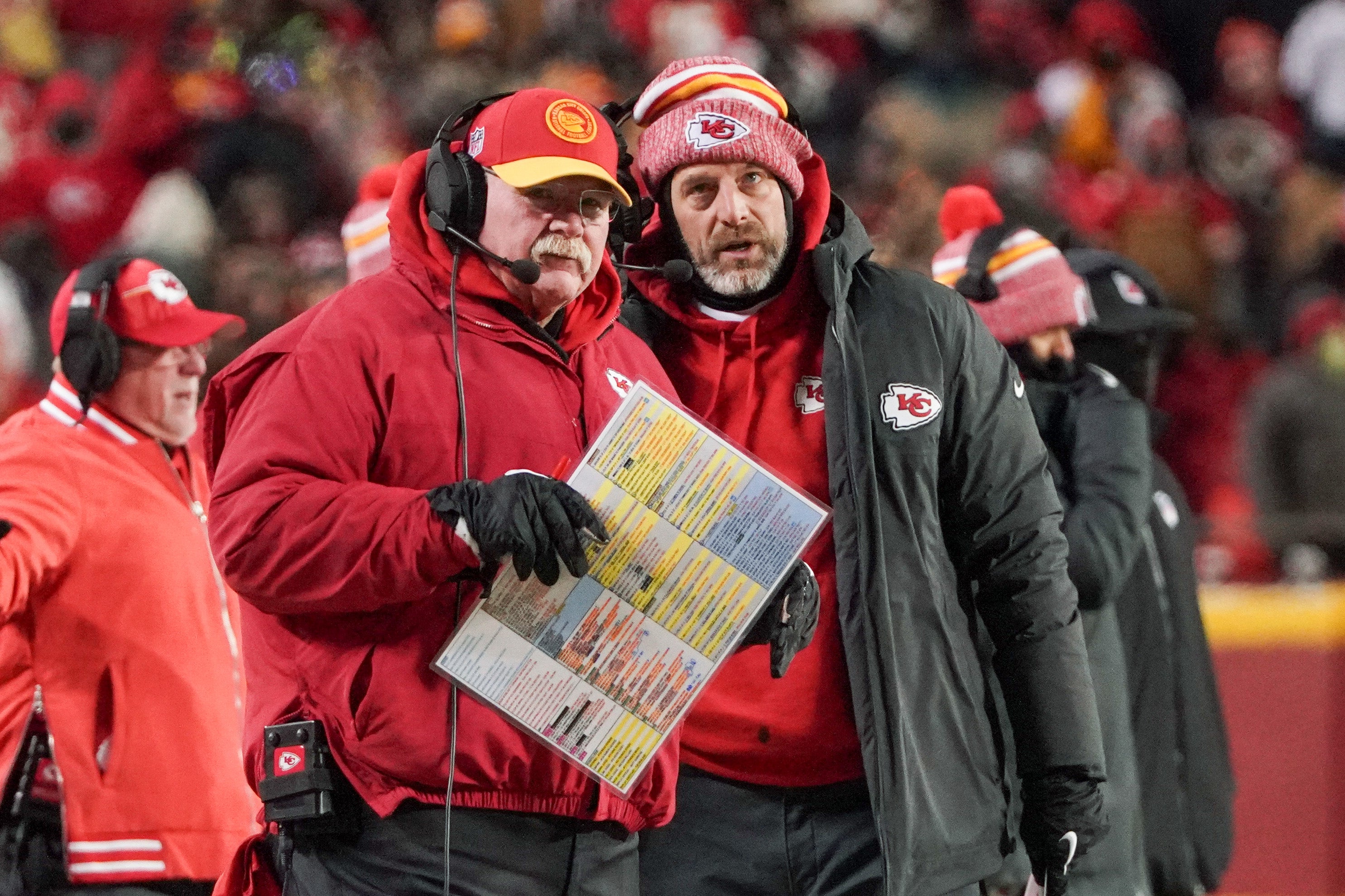 Jan 13, 2024; Kansas City, Missouri, USA; Kansas City Chiefs head coach Andy Reid talks with offensive coordinator Matt Nagy (right) against the Miami Dolphins in a 2024 AFC wild card game at GEHA Field at Arrowhead Stadium.
