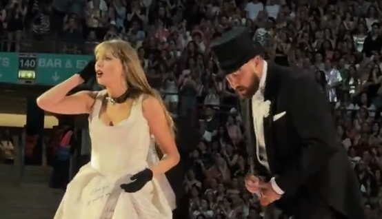 Taylor Swift brings Travis Kelce on stage during the Eras Tour on Sunday night