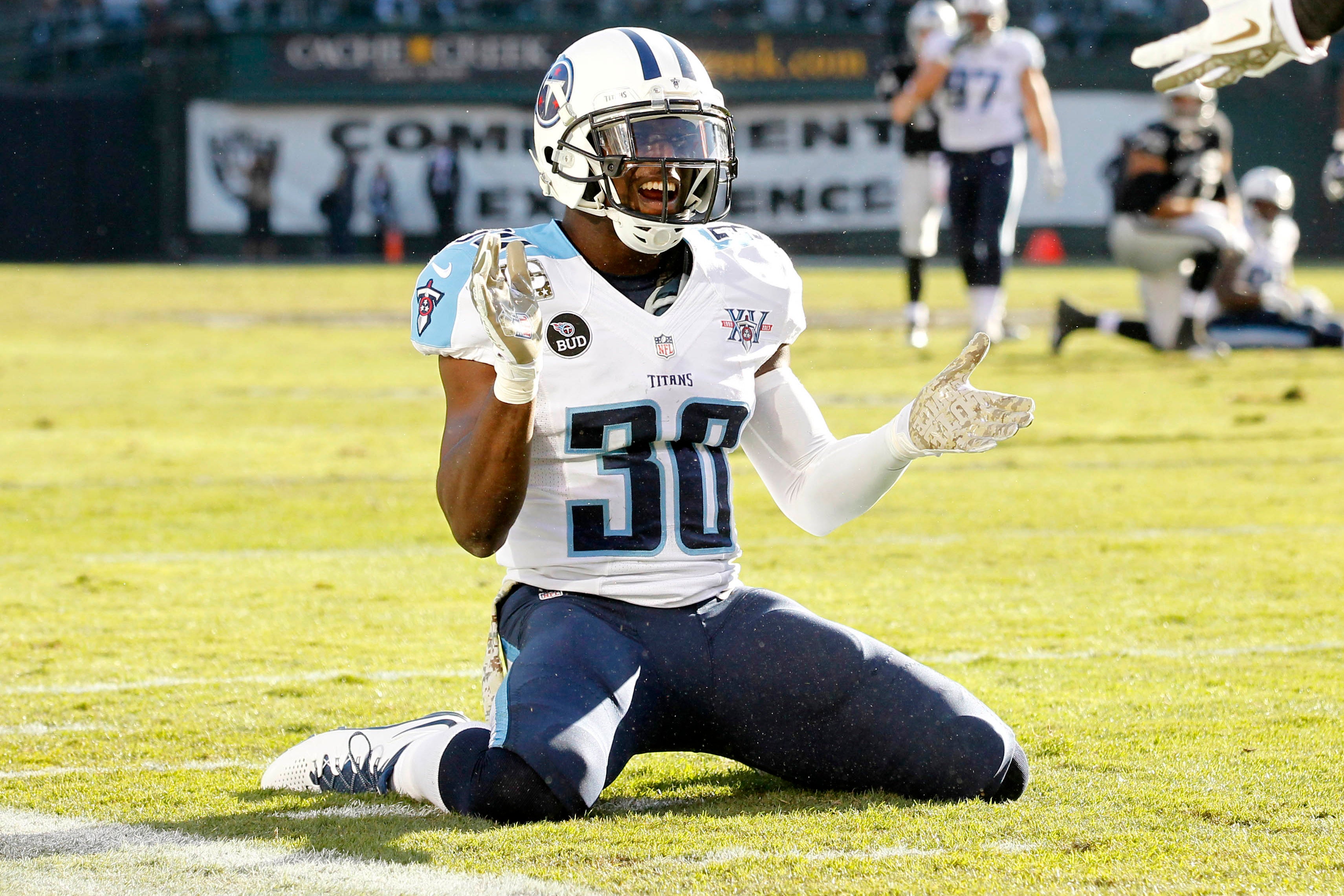 Tennessee Titans cornerback Jason McCourty (30) reacts after breaking up a pass intended for Oakland Raiders wide receiver Brice Butler (not pictured) in the second quarter at O.co Coliseum.