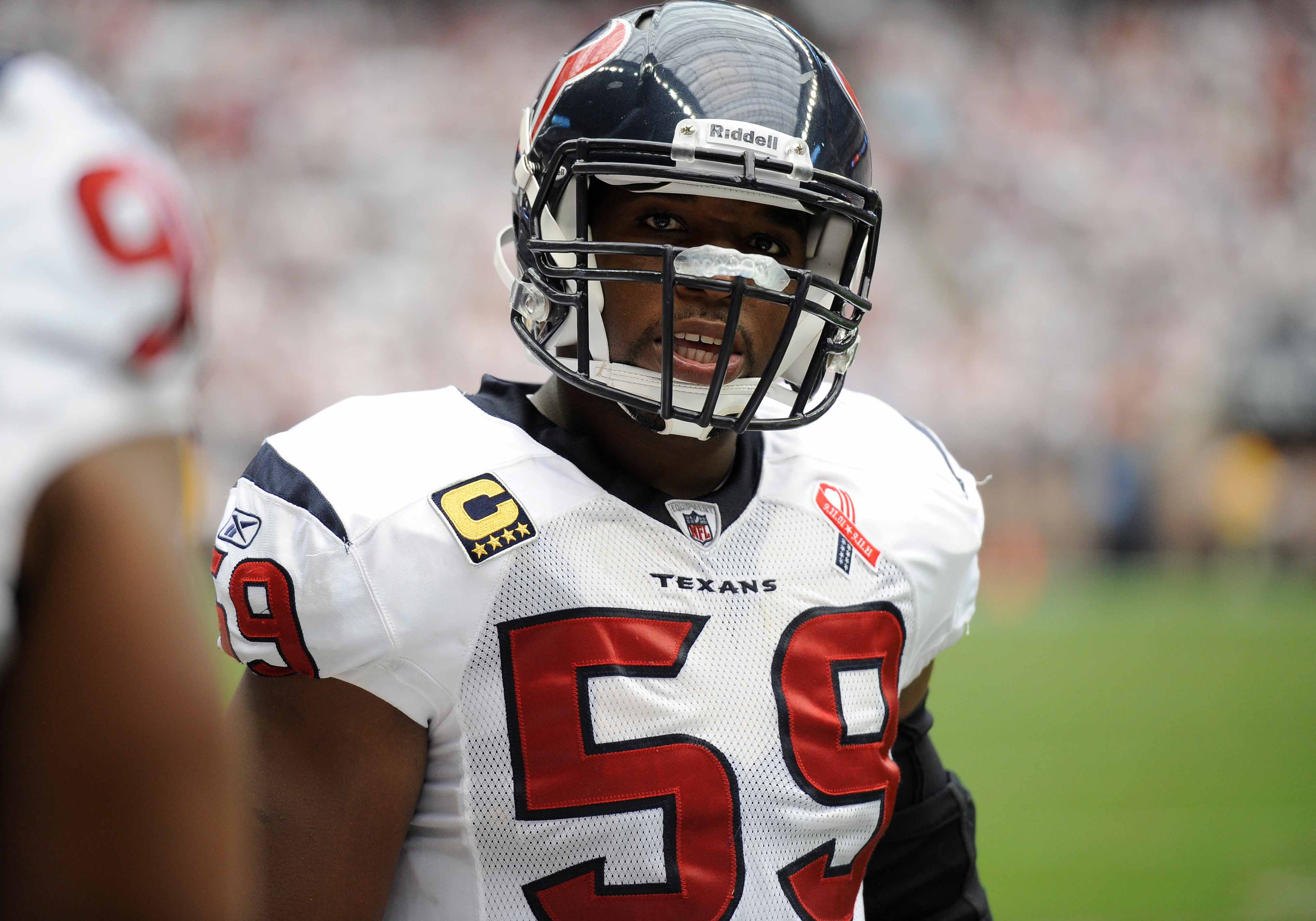 Houston Texans linebacker DeMeco Ryans (59) prepares the defense to take on the Indianapolis Colts at Reliant Stadium. The Texans defeated the Colts 34-7.