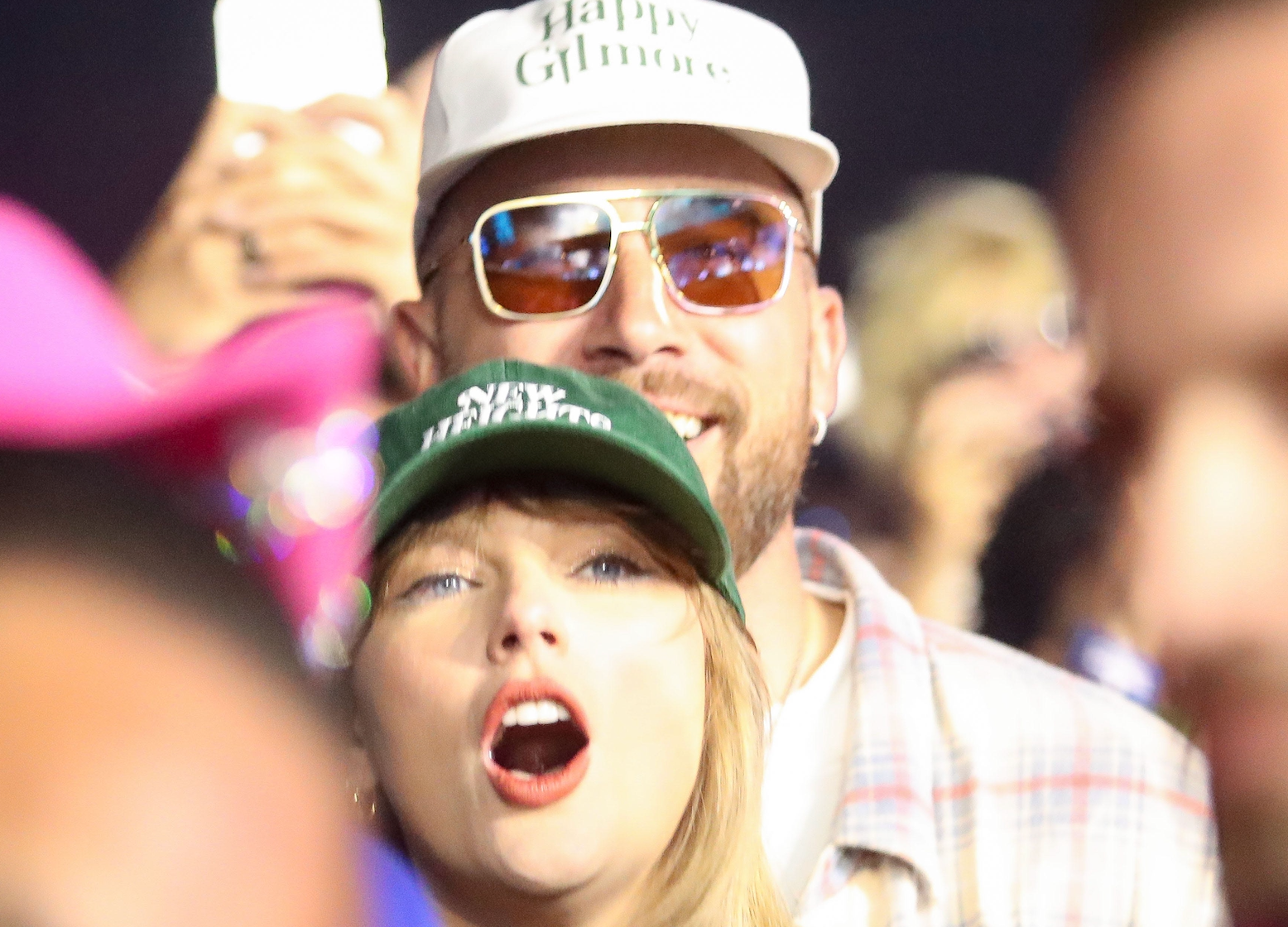 Taylor Swift and Travis KeIce watch as Ice Spice performs in the Sahara tent at the Coachella Valley Music and Arts Festival in Indio, Calif., April 13, 2024.