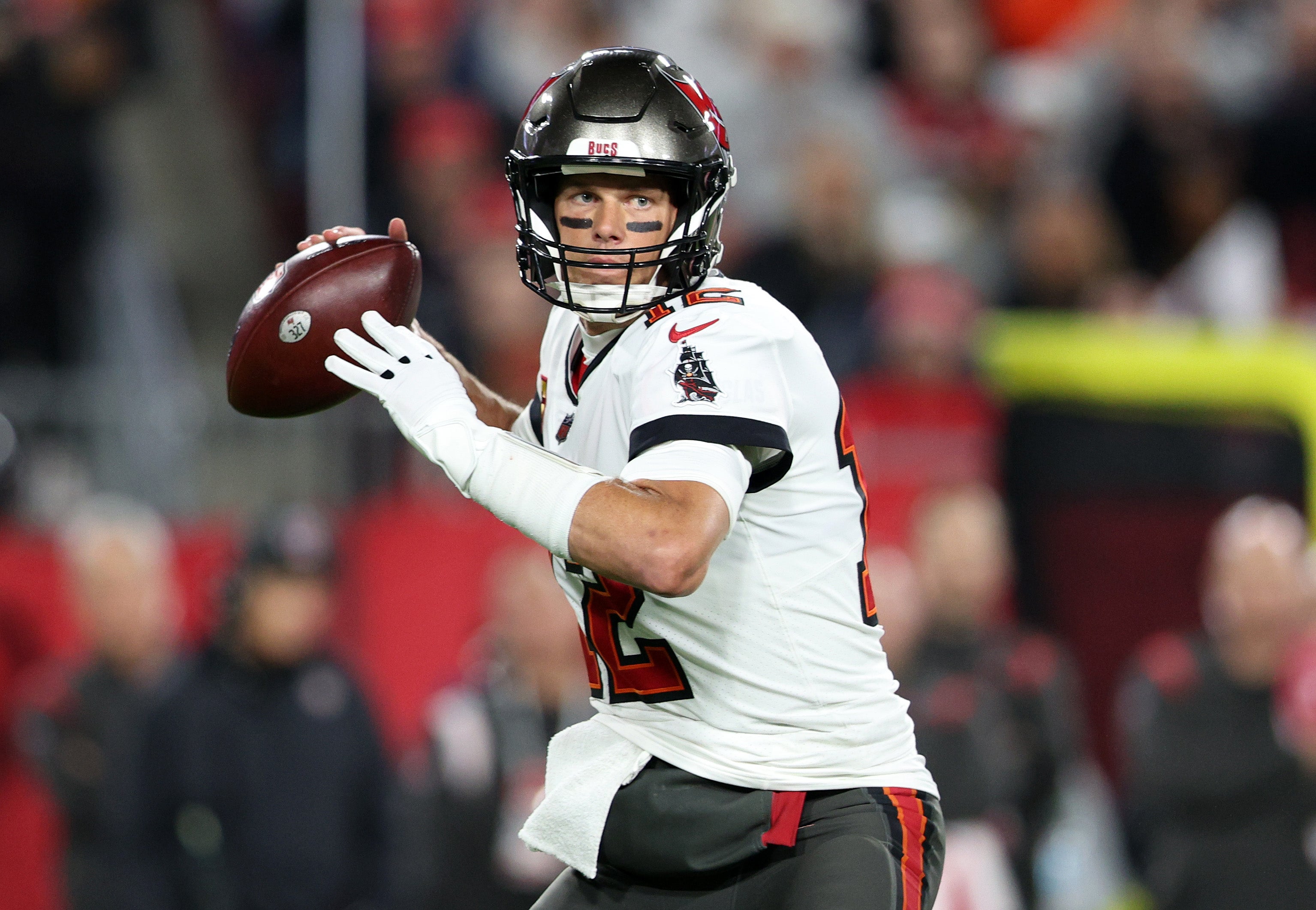 Tampa Bay Buccaneers quarterback Tom Brady (12) drops back to pass against the Dallas Cowboys during a wild card game at Raymond James Stadium.