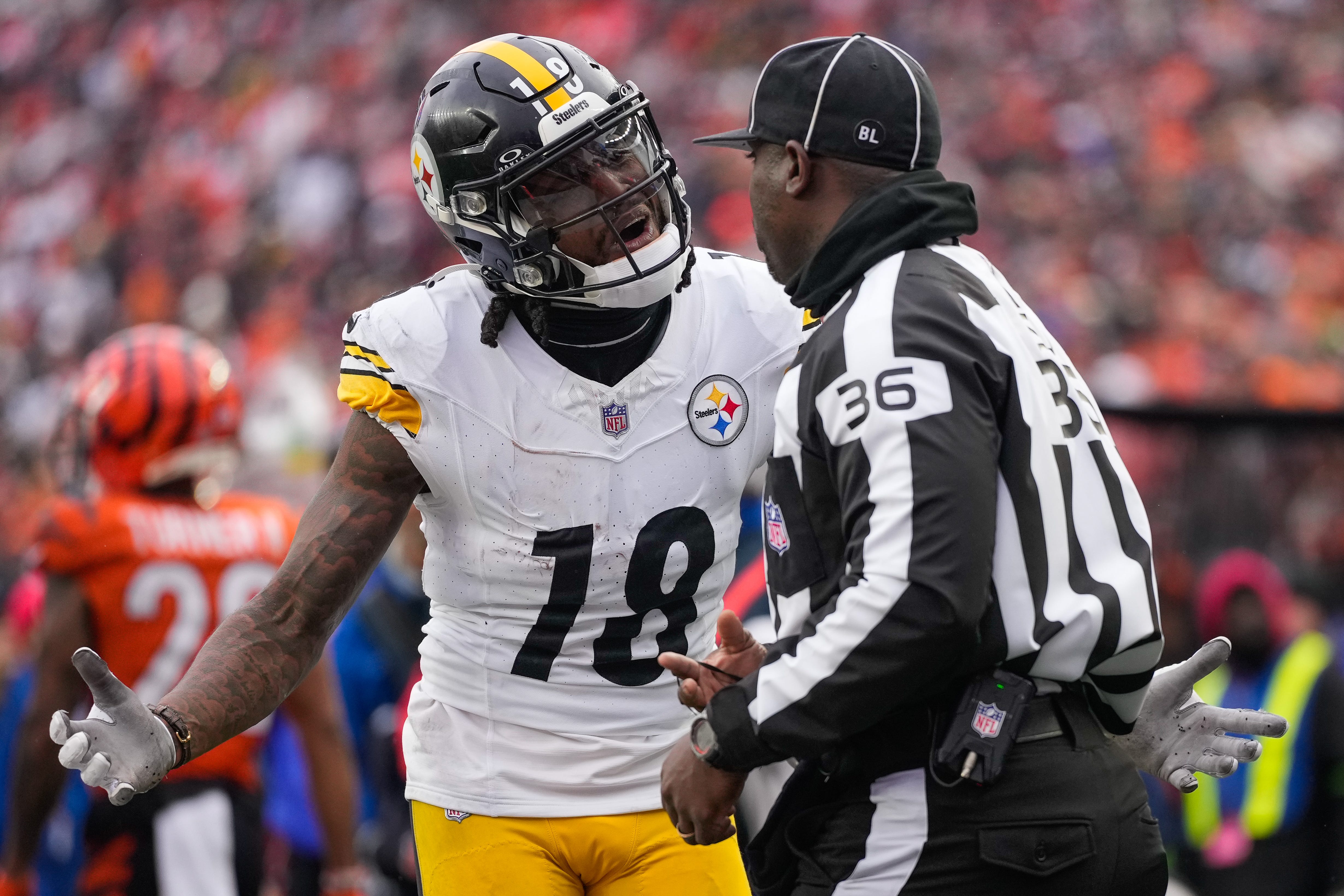 Pittsburgh Steelers wide receiver Diontae Johnson (18) appeals for a flag after a play in the fourth quarter of the NFL Week 12 game between the Cincinnati Bengals and the Pittsburgh Steelers at Paycor Stadium in Cincinnati on Sunday, Nov. 26, 2023. The Steelers took a 16-10 win over the Bengals in Cincinnati.  