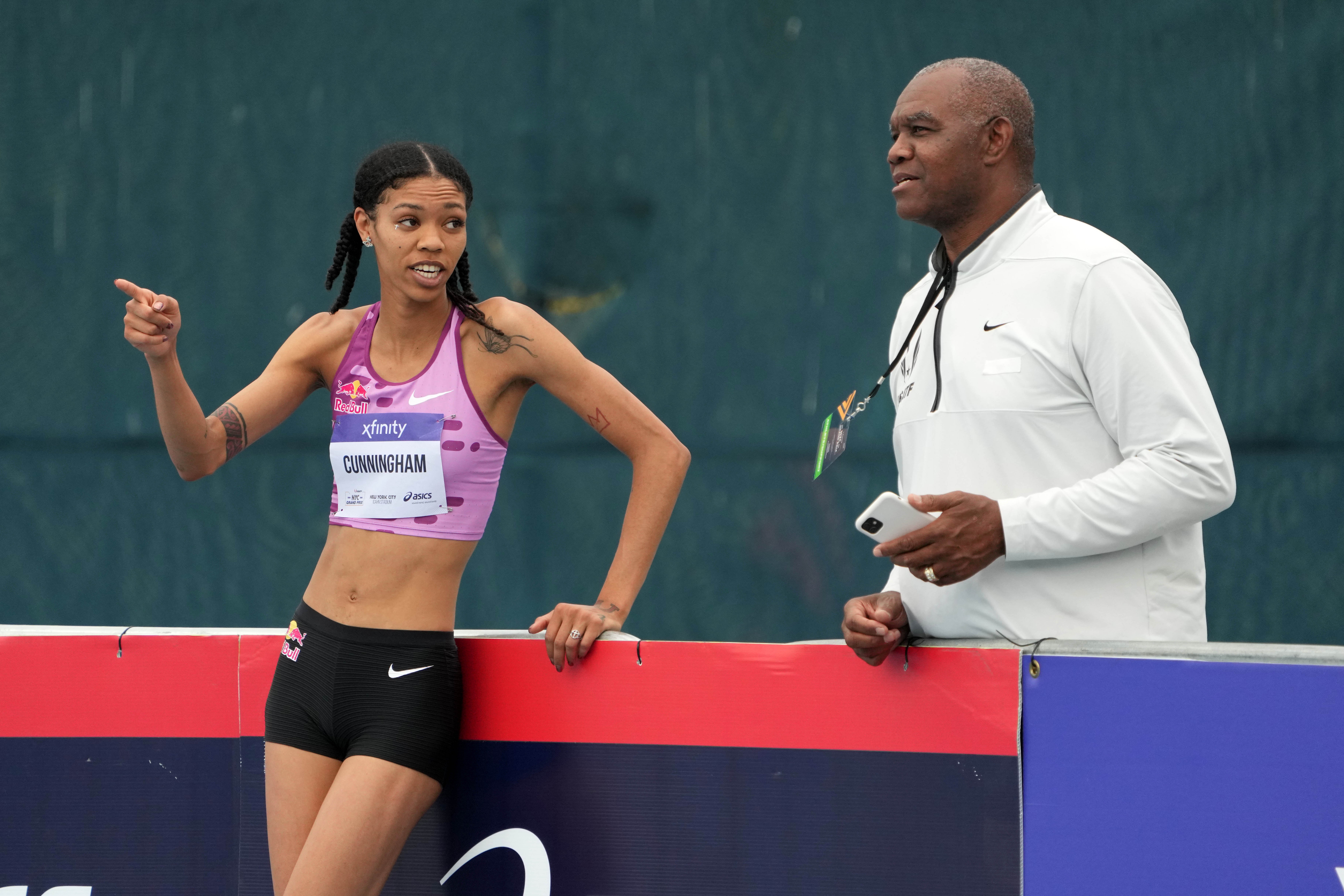 Vashti Cunningham (USA), left, talks with coach and father Randall Cunningham the women's high jump at 6-4 3/4 (1.95m) during the USATF Grand Prix at Icahn Stadium.