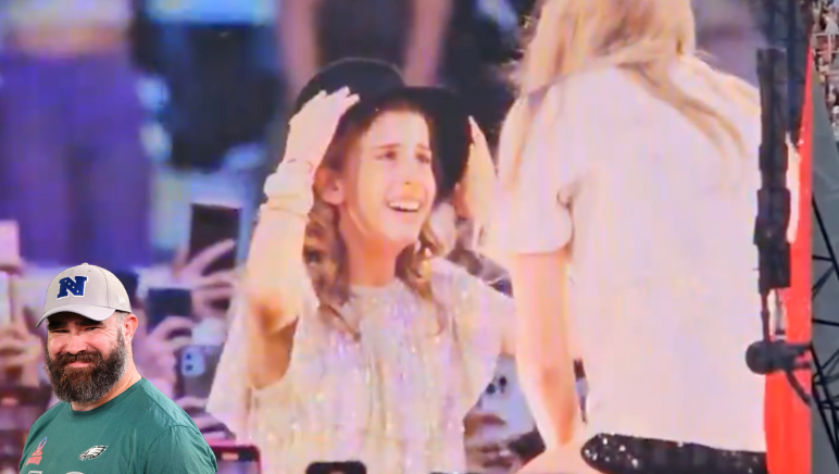 Taylor Swift gives a fan the 22 hat during her Eras Tour show in Lisbon, Portugal