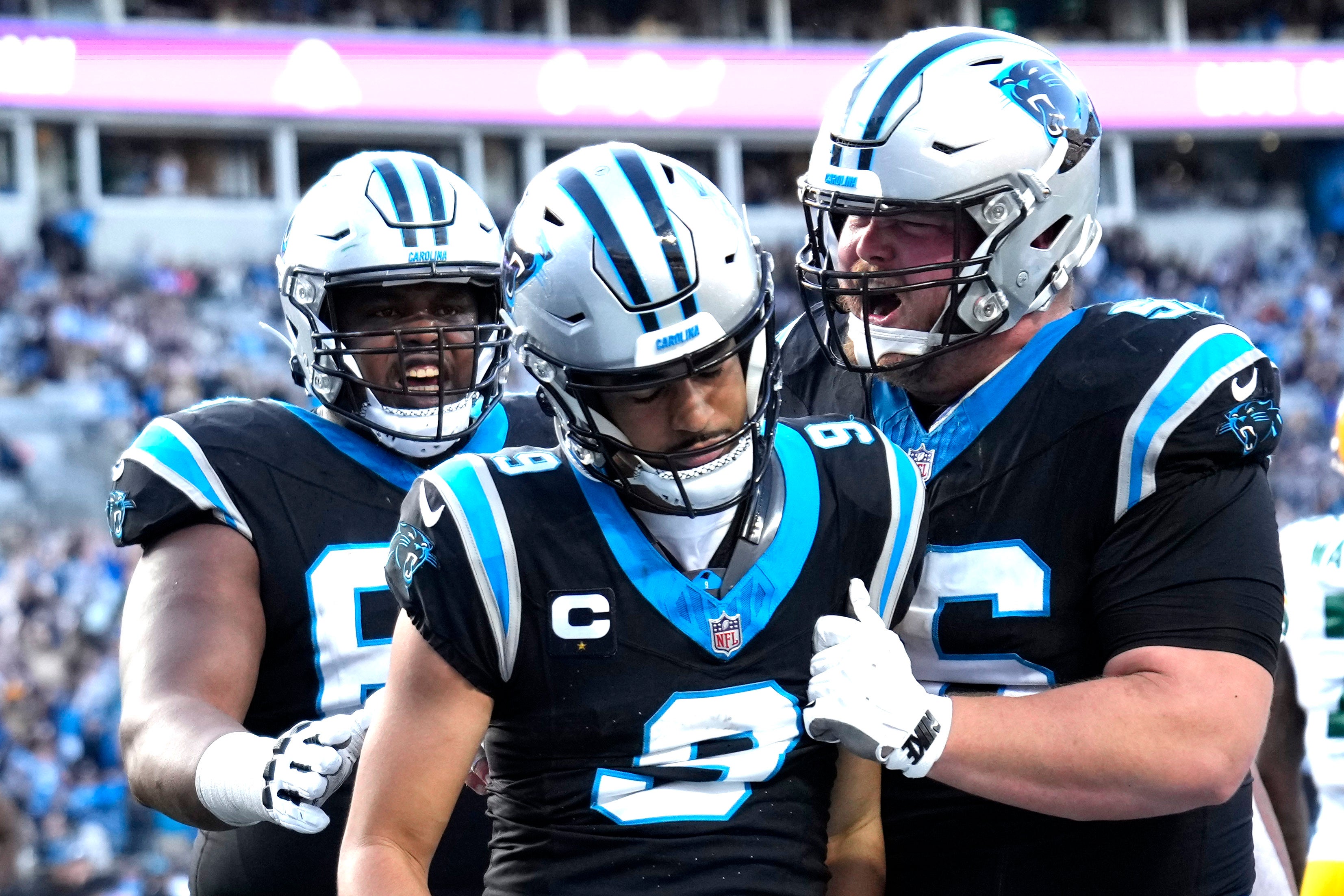 Dec 24, 2023; Charlotte, North Carolina, USA; Carolina Panthers quarterback Bryce Young (9) with guard Gabe Jackson (69) and center Bradley Bozeman (56) in the fourth quarter at Bank of America Stadium. Mandatory Credit: Bob Donnan-USA TODAY Sports