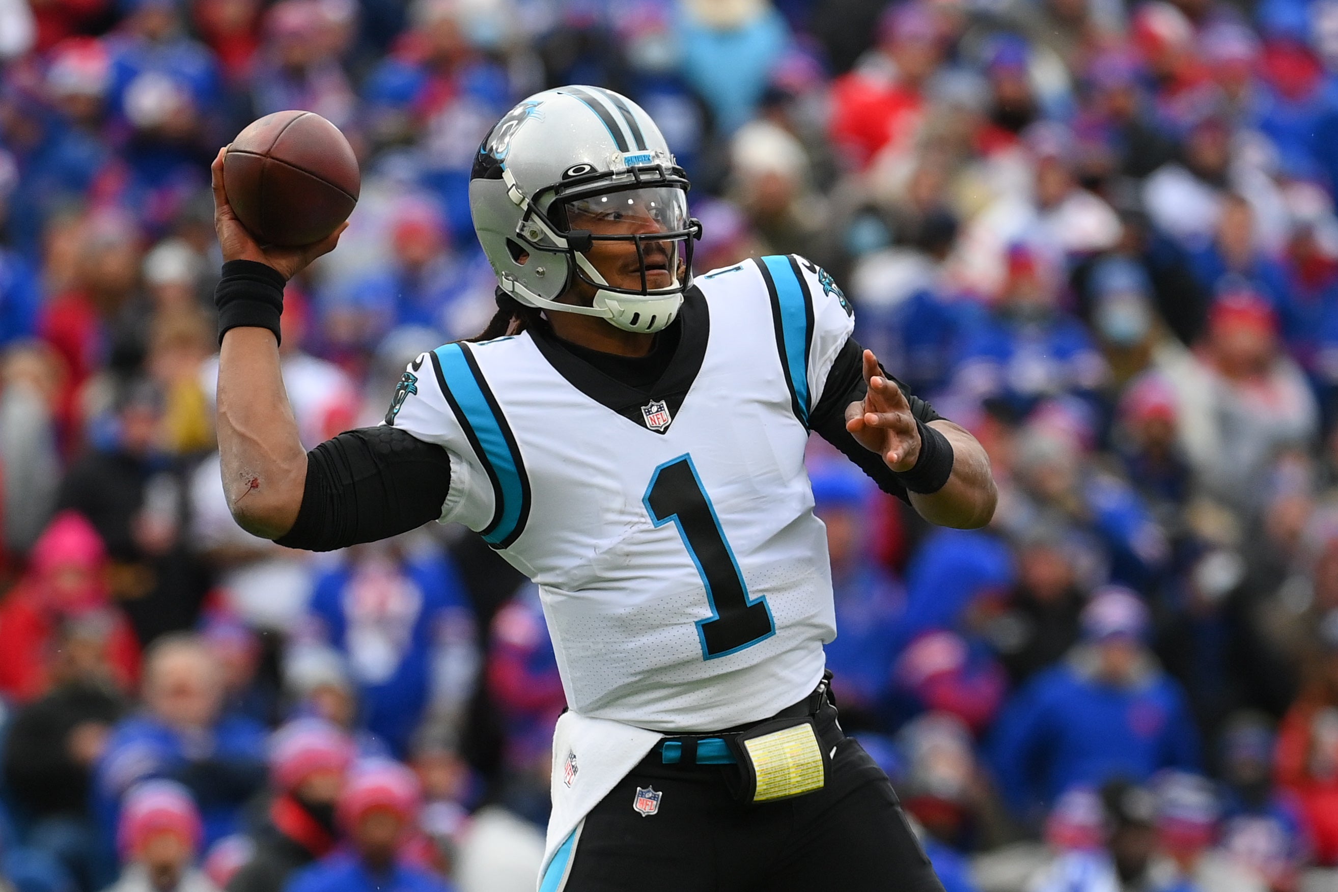 Dec 19, 2021; Orchard Park, New York, USA; Carolina Panthers quarterback Cam Newton (1) passes the ball against the Buffalo Bills during the first half at Highmark Stadium. Mandatory Credit: Rich Barnes-USA TODAY Sports