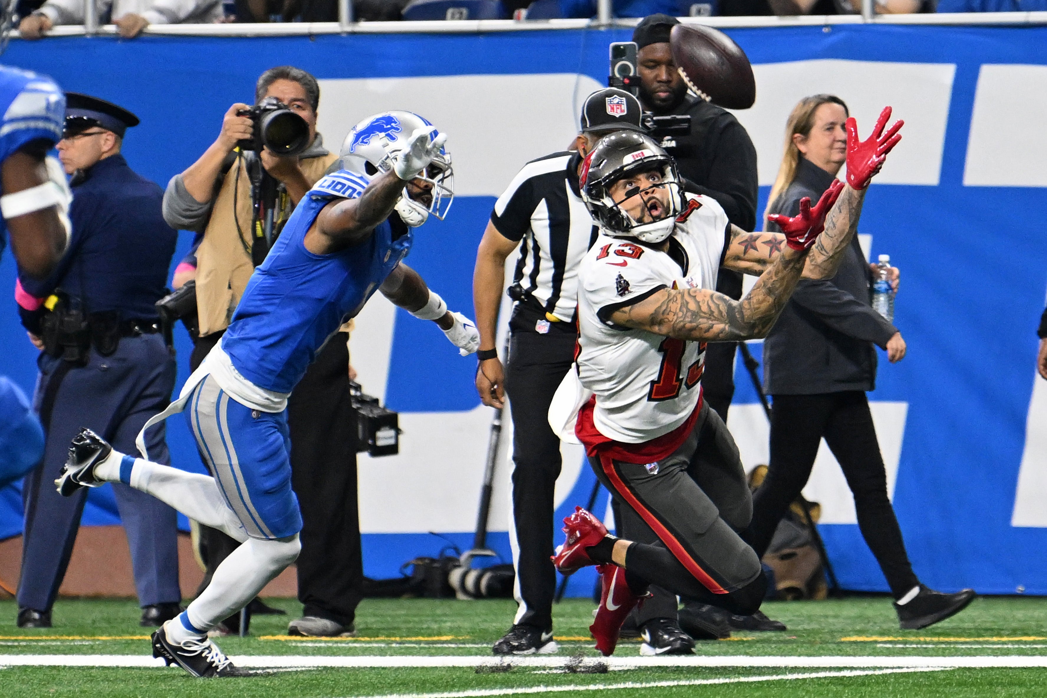 Jan 21, 2024; Detroit, Michigan, USA; Tampa Bay Buccaneers wide receiver Mike Evans (13) reaches for the ball against the Detroit Lions during the first half in a 2024 NFC divisional round game at Ford Field.