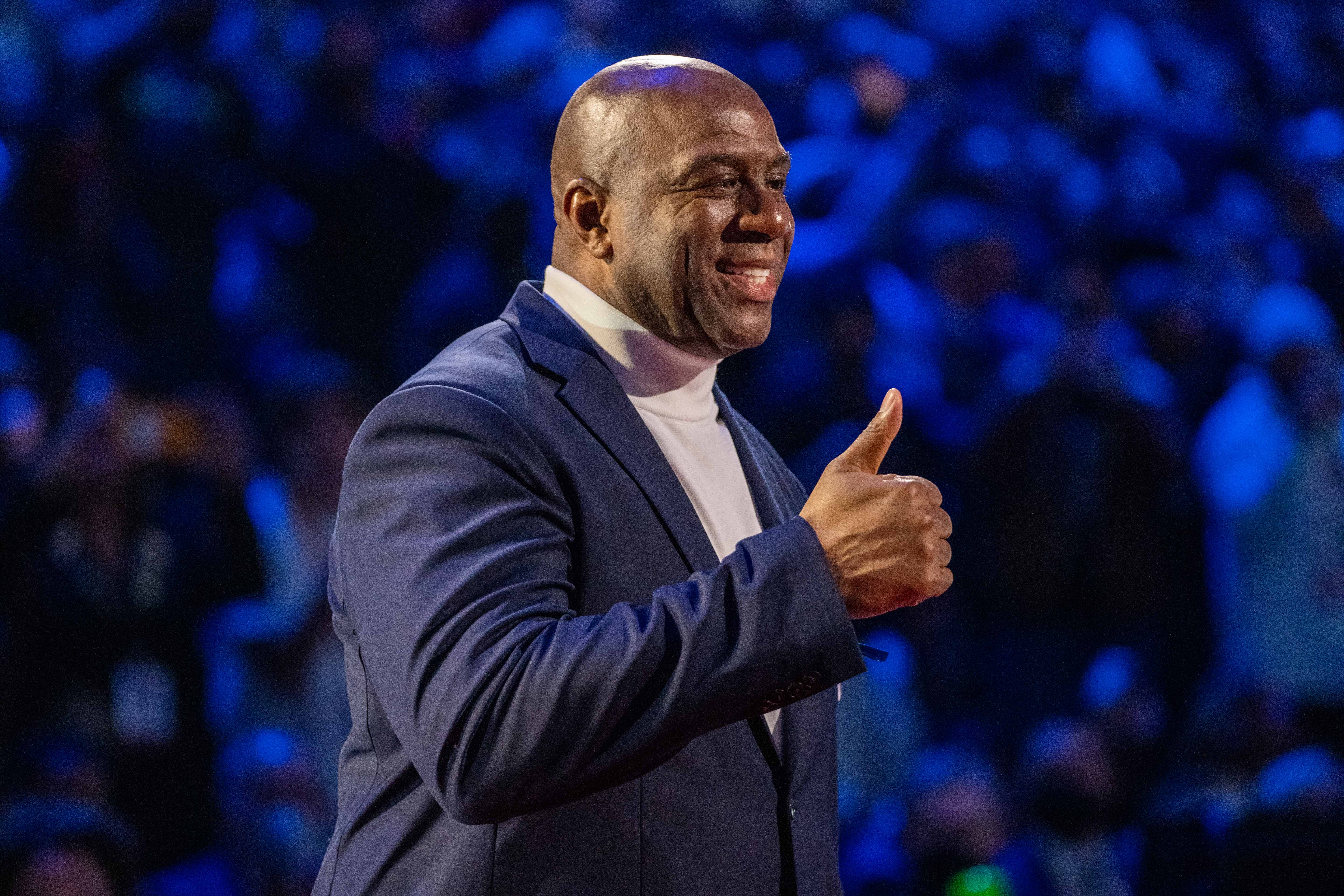 February 20, 2022; Cleveland, Ohio, USA; NBA great Magic Johnson is honored for being selected to the NBA 75th Anniversary Team during halftime in the 2022 NBA All-Star Game at Rocket Mortgage FieldHouse.