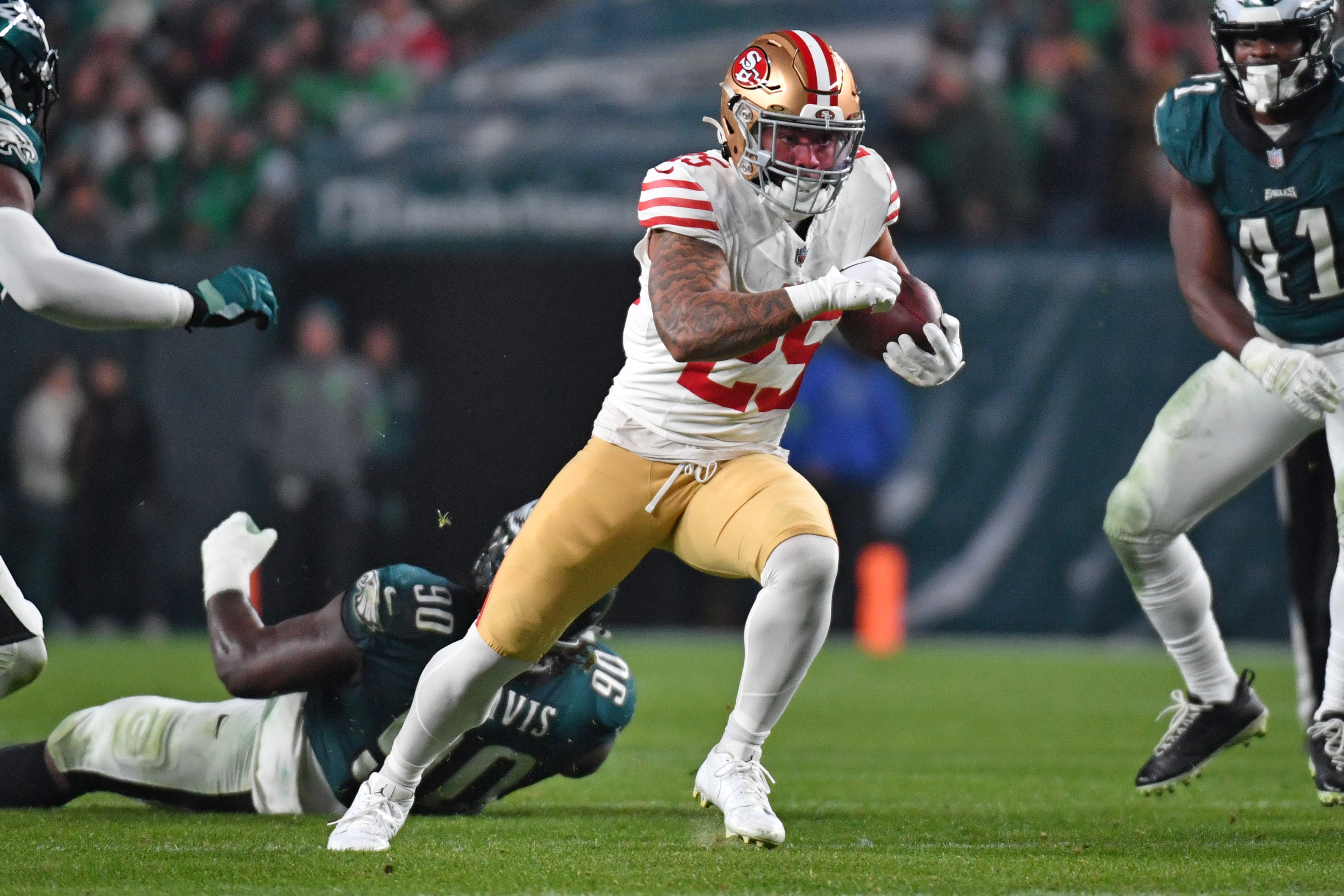 Dec 3, 2023; Philadelphia, Pennsylvania, USA; San Francisco 49ers running back Elijah Mitchell (25) runs against the Philadelphia Eagles at Lincoln Financial Field.