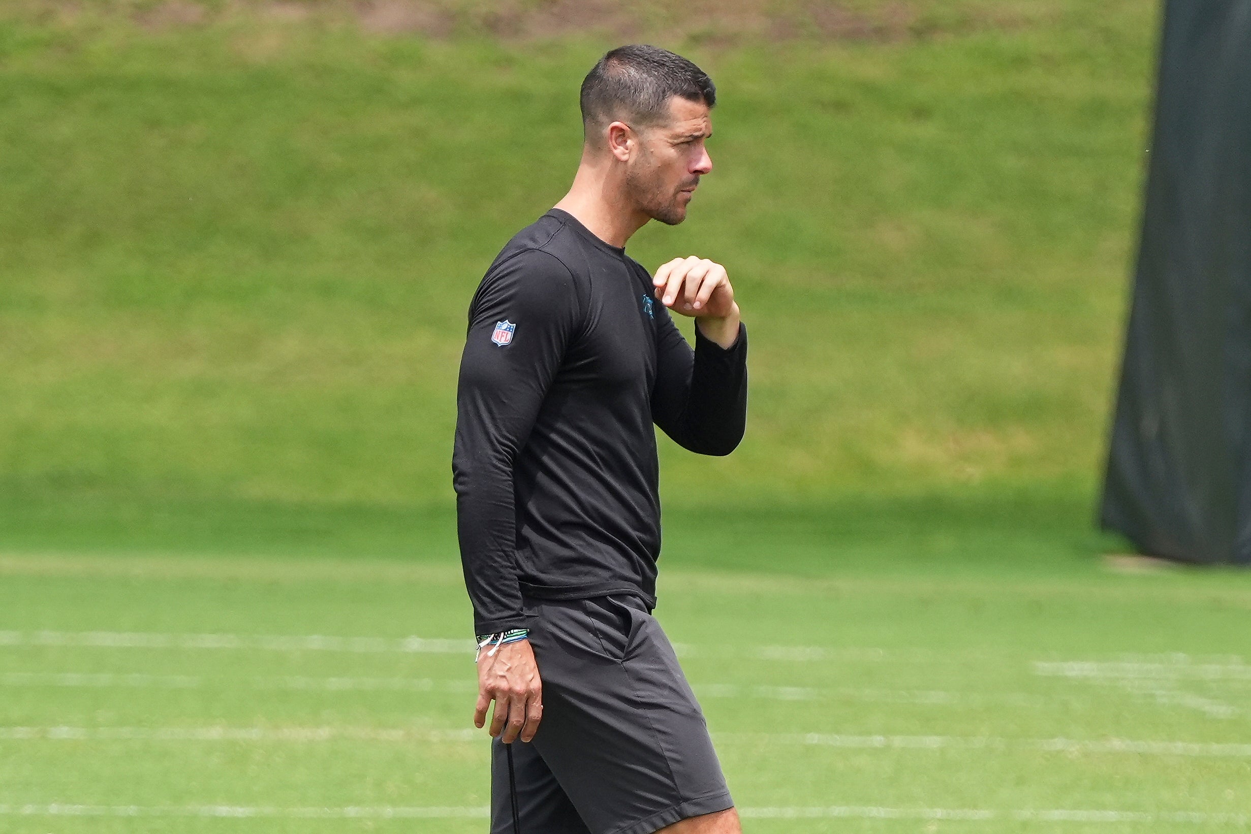 Jun 4, 2024; Charlotte, NC, USA; Carolina Panthers Head Coach Dave Canales walks across the field during OTAs. Mandatory Credit: Jim Dedmon-USA TODAY Sports