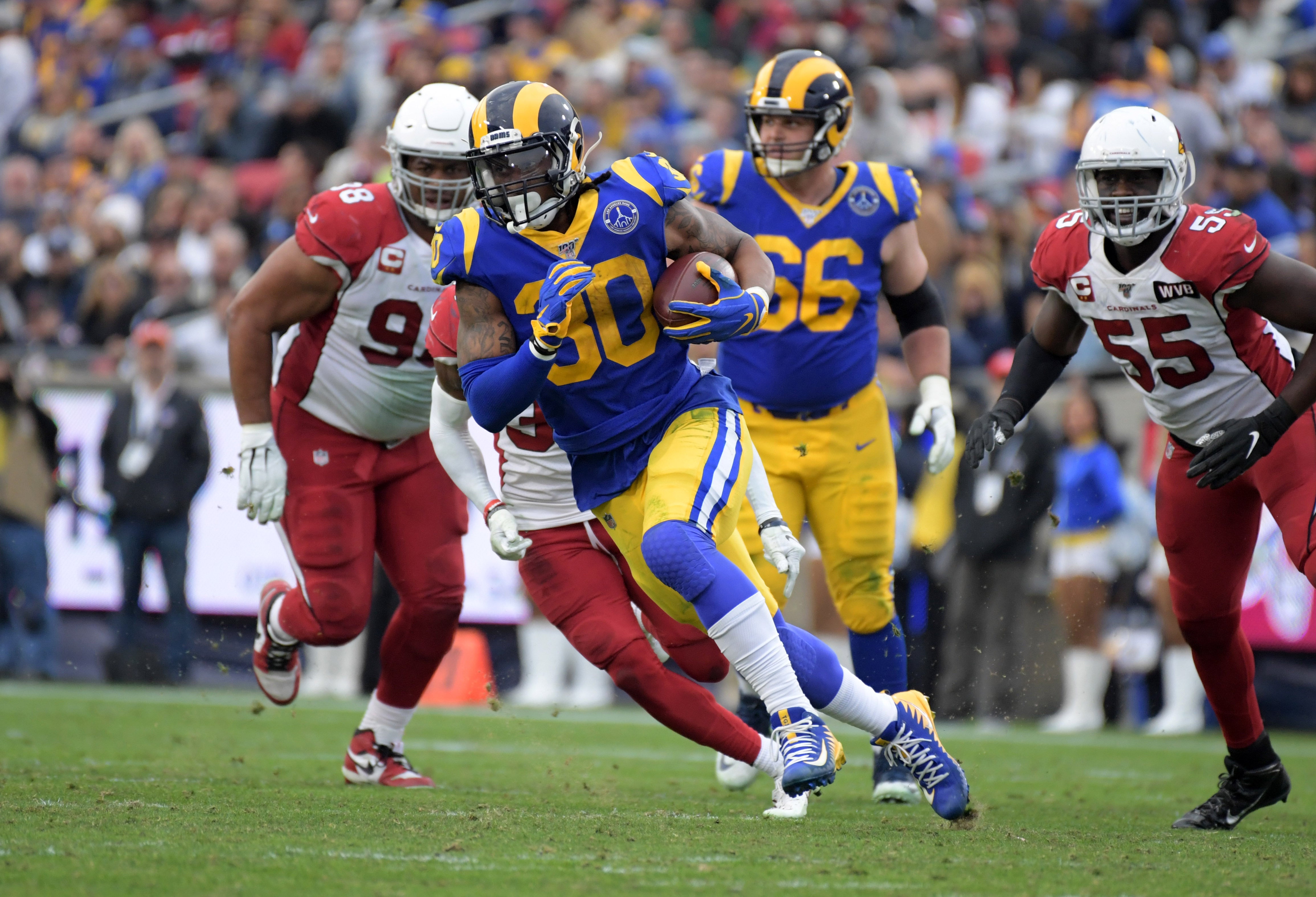 Dec 29, 2019; Los Angeles, California, USA; Los Angeles Rams running back Todd Gurley (30) carries the ball in the third quarter of the final Rams home game at Los Angeles Memorial Coliseum before moving to SoFi Stadium for the 2020 season. The Rams defeated the Cardinals 31-24 Mandatory Credit: Kirby Lee-USA TODAY Sports
