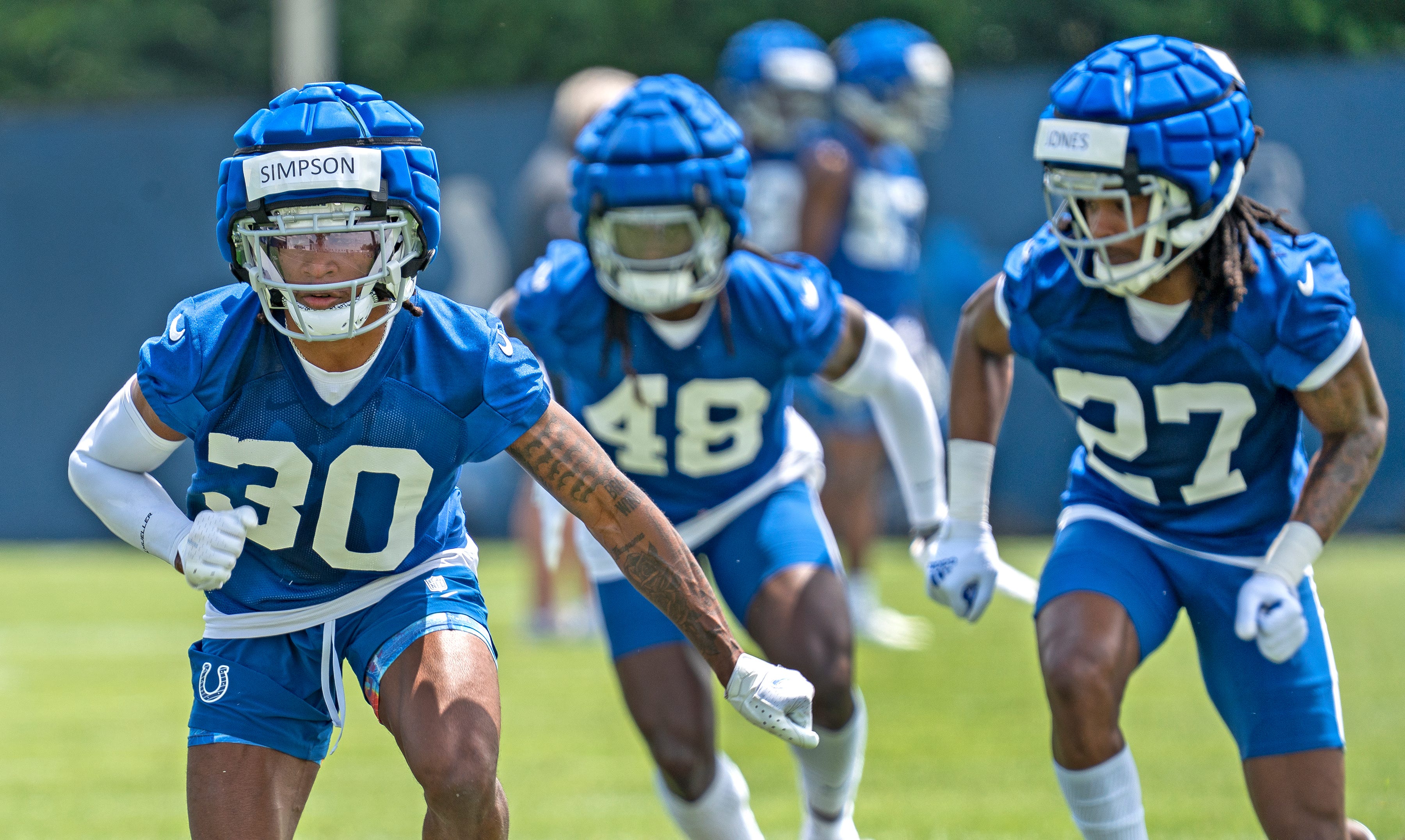 Colts players, including Jaylin Simpson (30), run drills during Indianapolis Colts minicamp practice Tuesday, June 4, 2024 at the Indiana Farm Bureau Football Center.