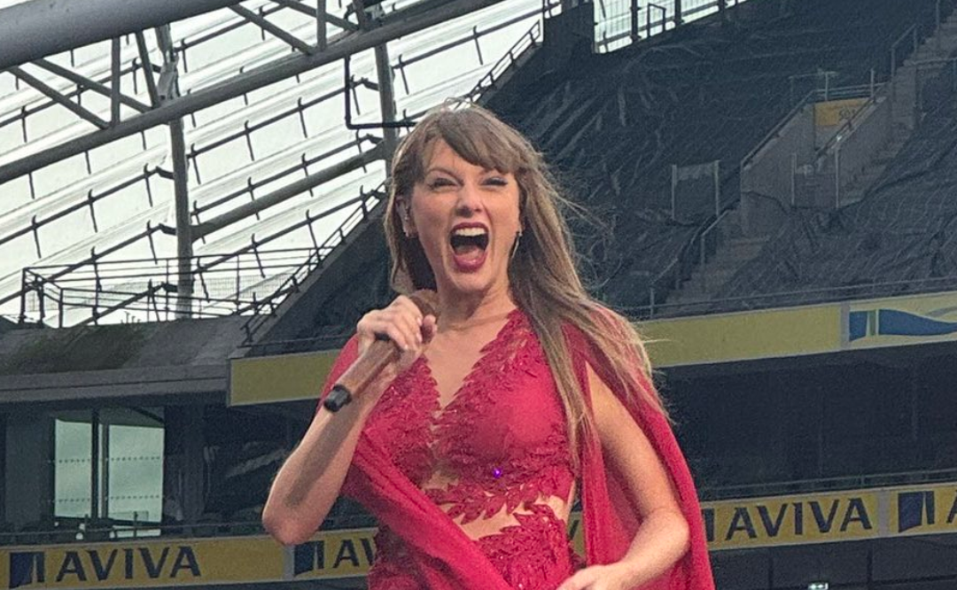 Taylor Swift grins as she sees Travis Kelce arrived while performing her third and final sold out show in Dublin.