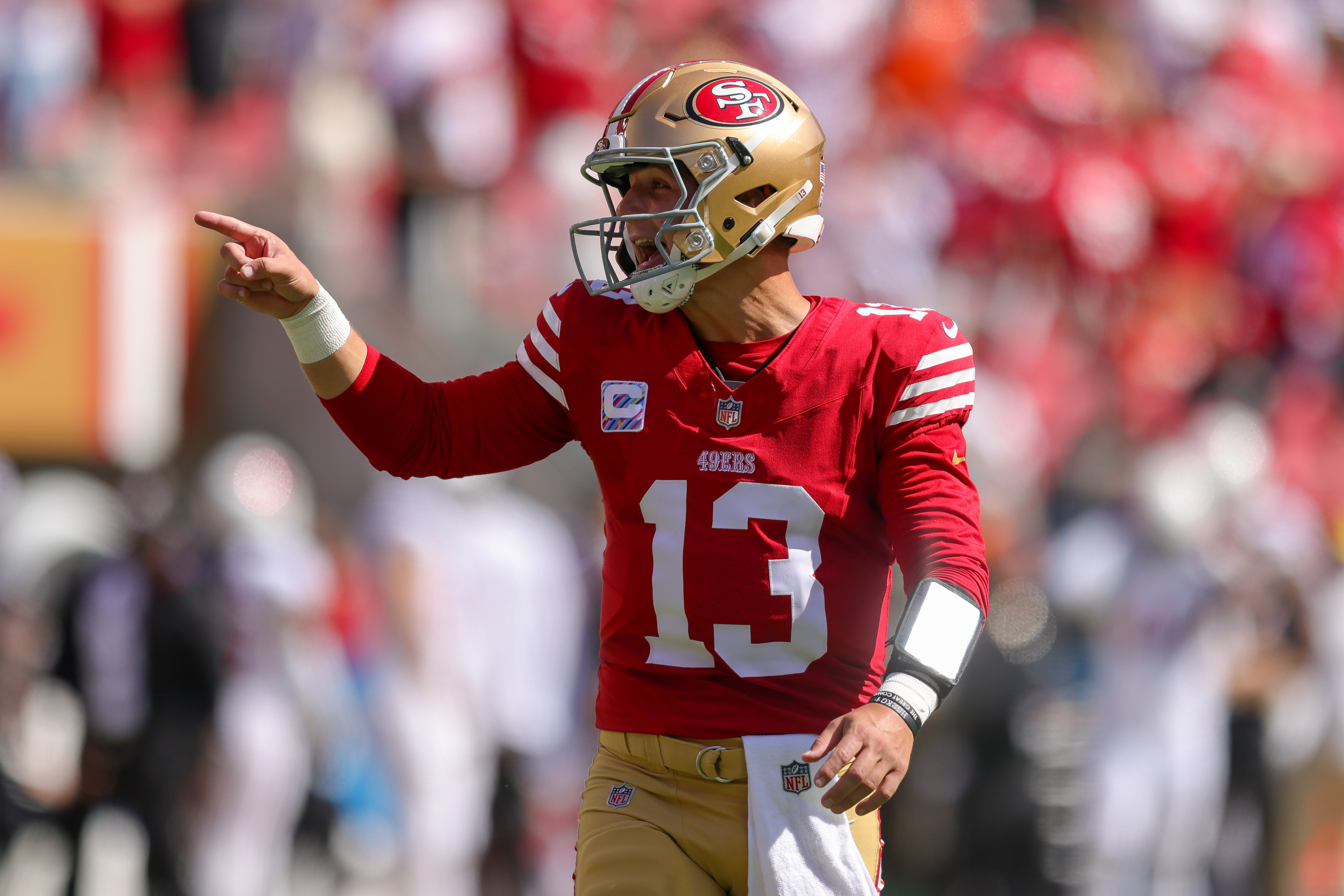 Oct 1, 2023; Santa Clara, California, USA; San Francisco 49ers quarterback Brock Purdy (13) celebrates after a touchdown during the second quarter against the Arizona Cardinals at Levi's Stadium.