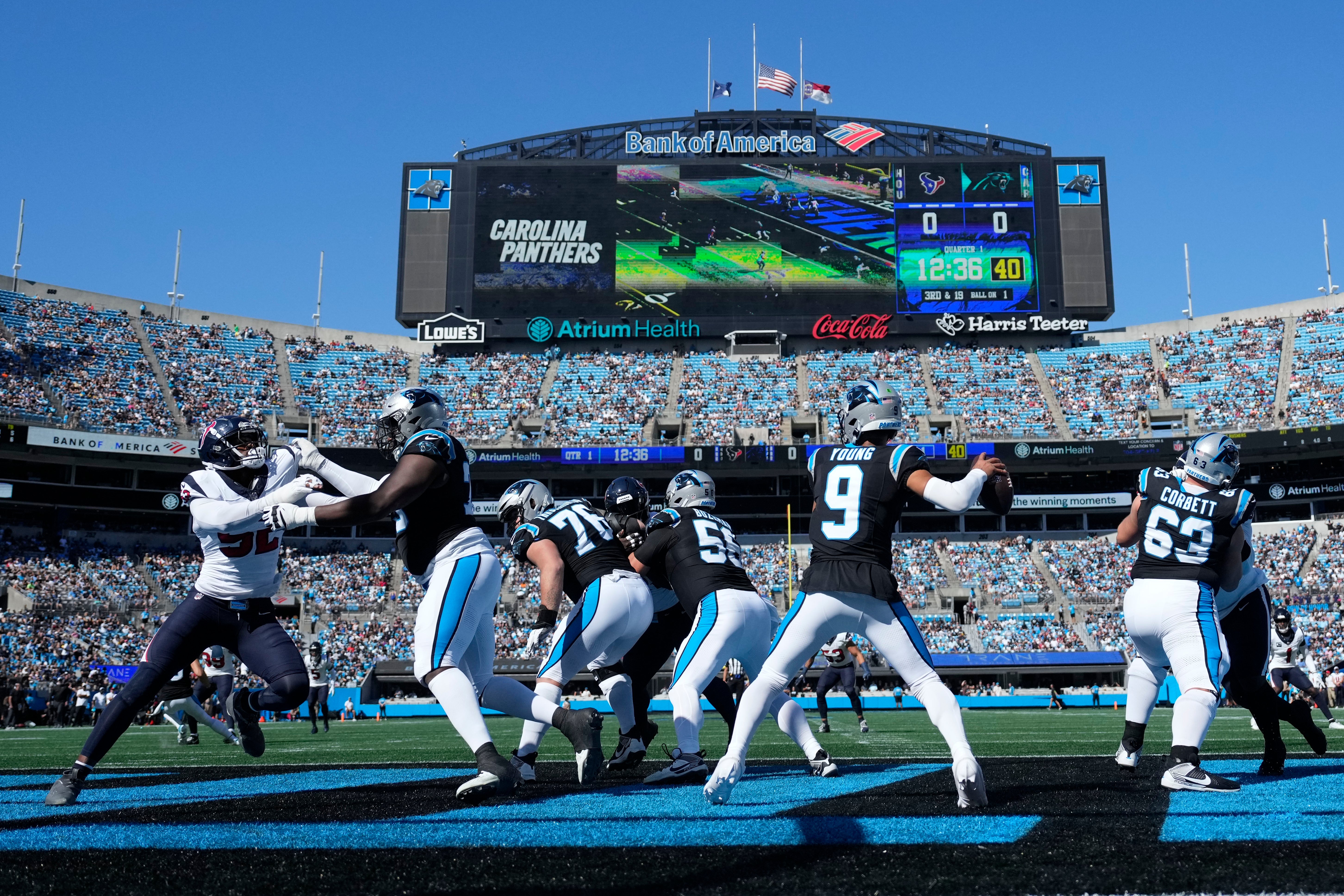 Oct 29, 2023; Charlotte, North Carolina, USA; Carolina Panthers quarterback Bryce Young (9) looks to pass as Houston Texans defensive end Jonathan Greenard (52) pressures in the first quarter at Bank of America Stadium. Mandatory Credit: Bob Donnan-USA TODAY Sports