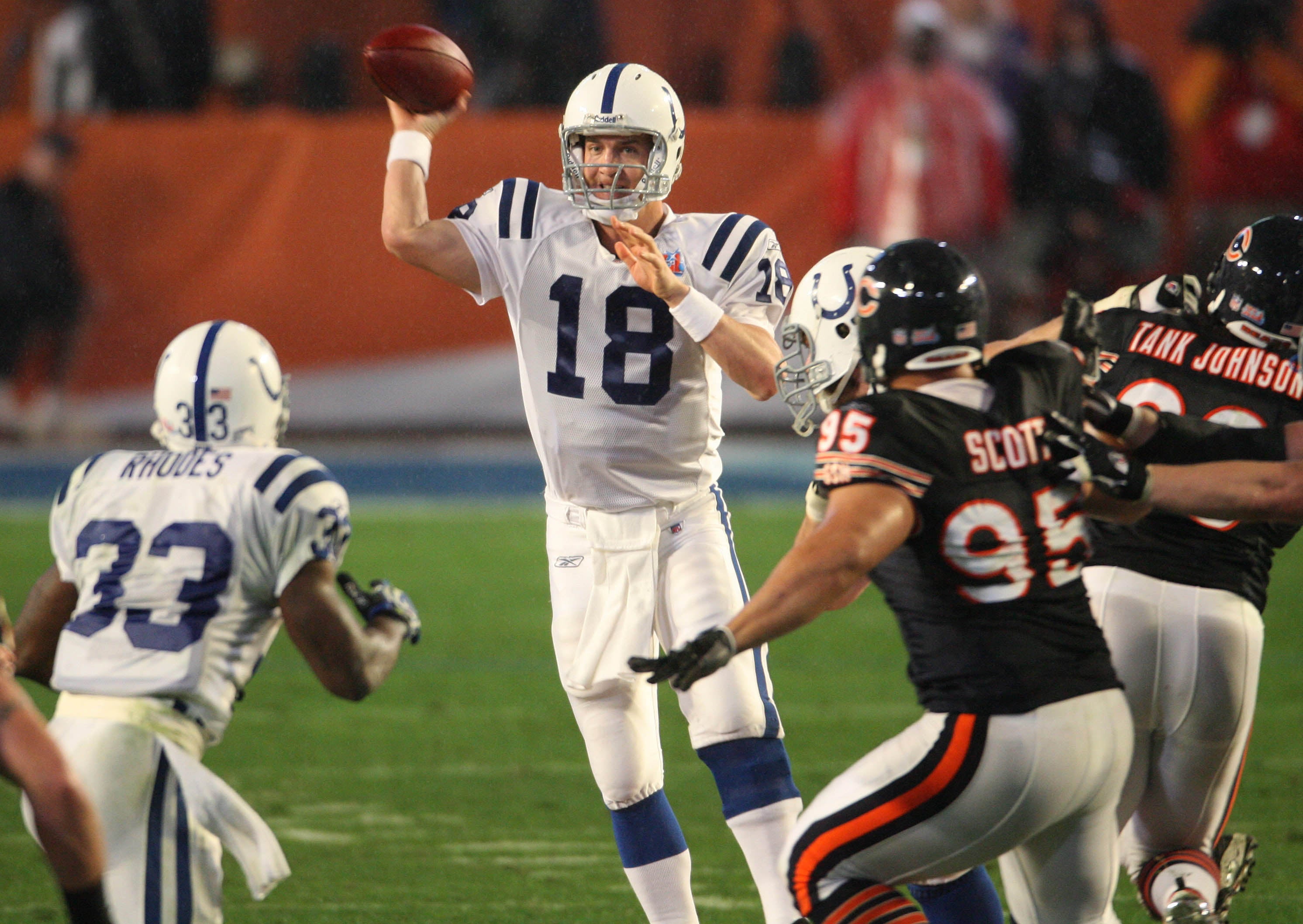 Feb 4, 2007; Miami, FL, USA; Indianapolis Colts quarterback Peyton Manning (18) throws to running back Dominic Rhodes against the Chicago Bears in the first half of Super Bowl XLI at Dolphins Stadium.