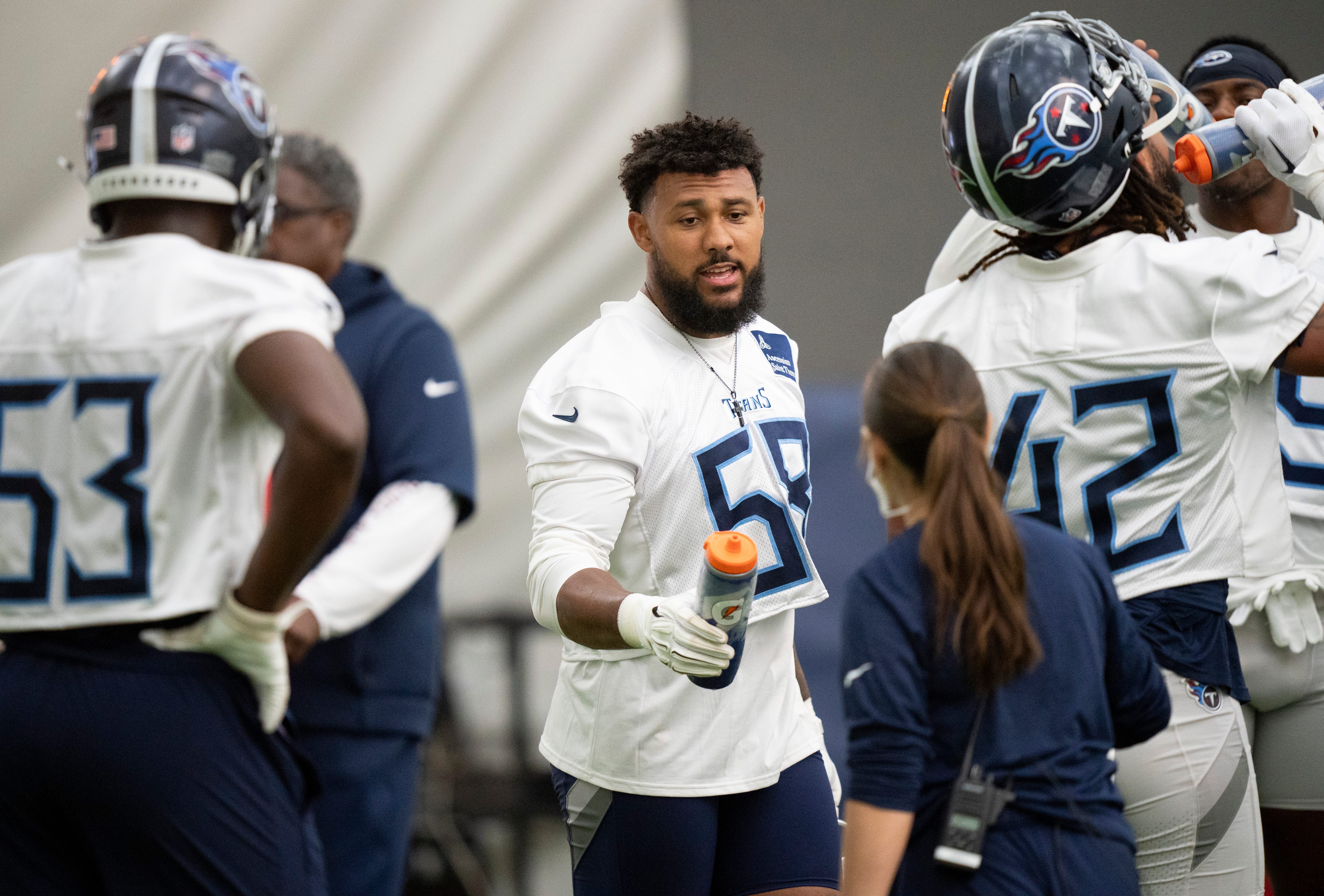 Outside linebacker Harold Landry III takes a water break during the Tennessee Titans mandatory mini-camp at Ascension Saint Thomas Sports Park in Nashville, Tenn., Tuesday, June 4, 2024 Denny Simmons / The Tennessean-USA TODAY NETWORK