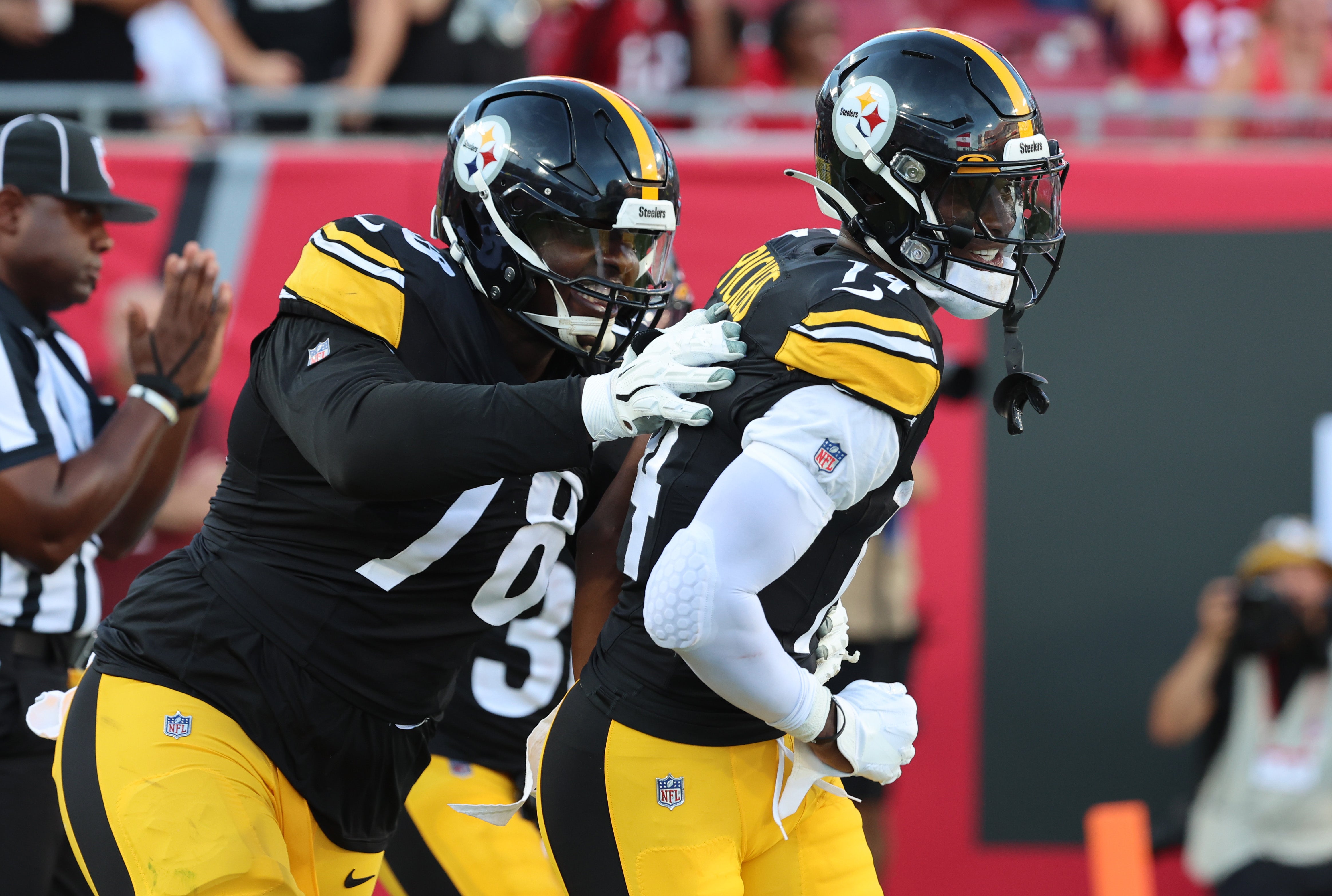 Aug 11, 2023; Tampa, Florida, USA; Pittsburgh Steelers wide receiver George Pickens (14) celebrates with guard James Daniels (78) after scoring a touchdown against the Tampa Bay Buccaneers during the first quarter at Raymond James Stadium. Mandatory Credit: Kim Klement Neitzel-USA TODAY Sports