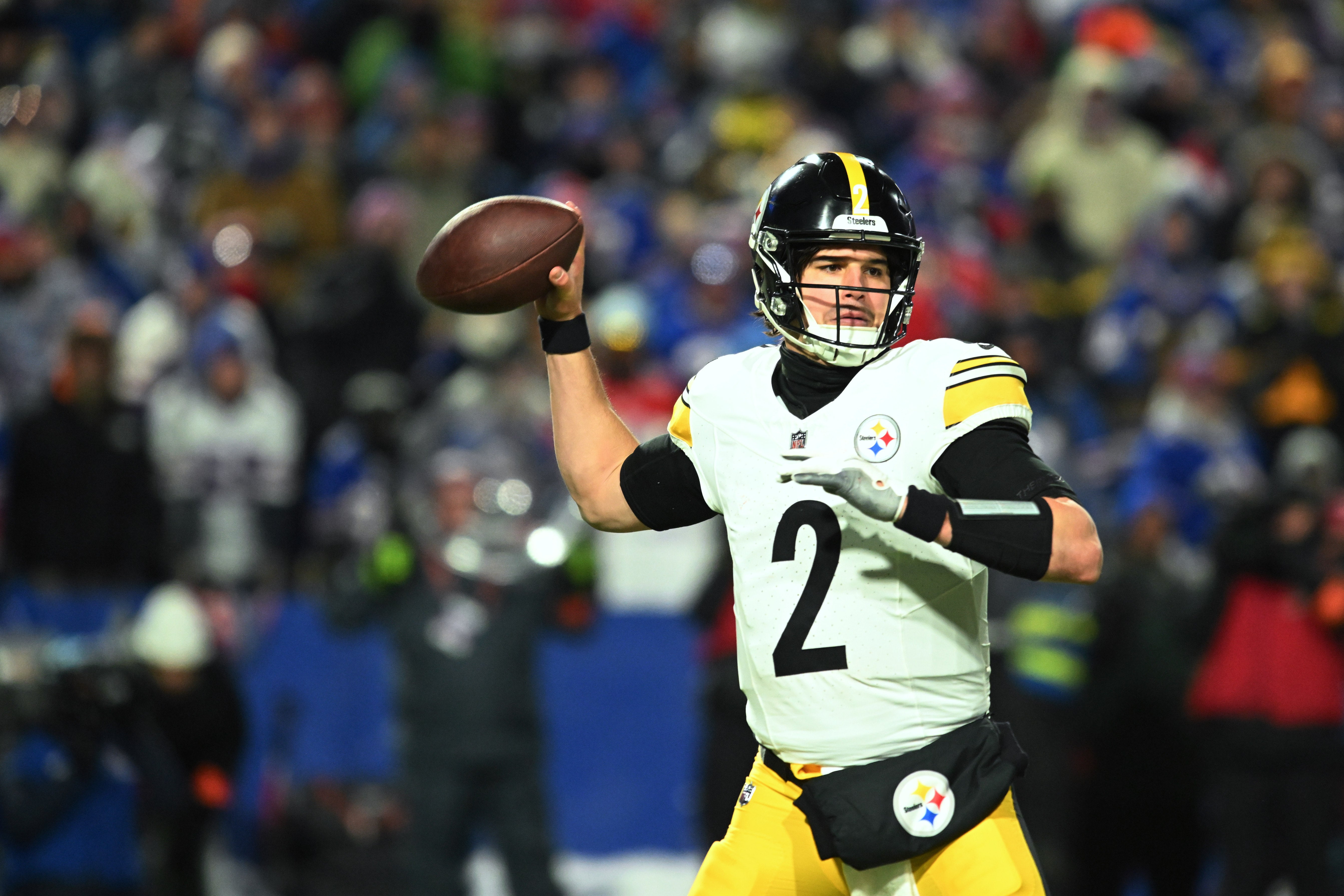 Jan 15, 2024; Orchard Park, New York, USA; Pittsburgh Steelers quarterback Mason Rudolph (2) plays the ball in the second half against the Buffalo Bills in a 2024 AFC wild card game at Highmark Stadium. Mandatory Credit: Mark Konezny-USA TODAY Sports