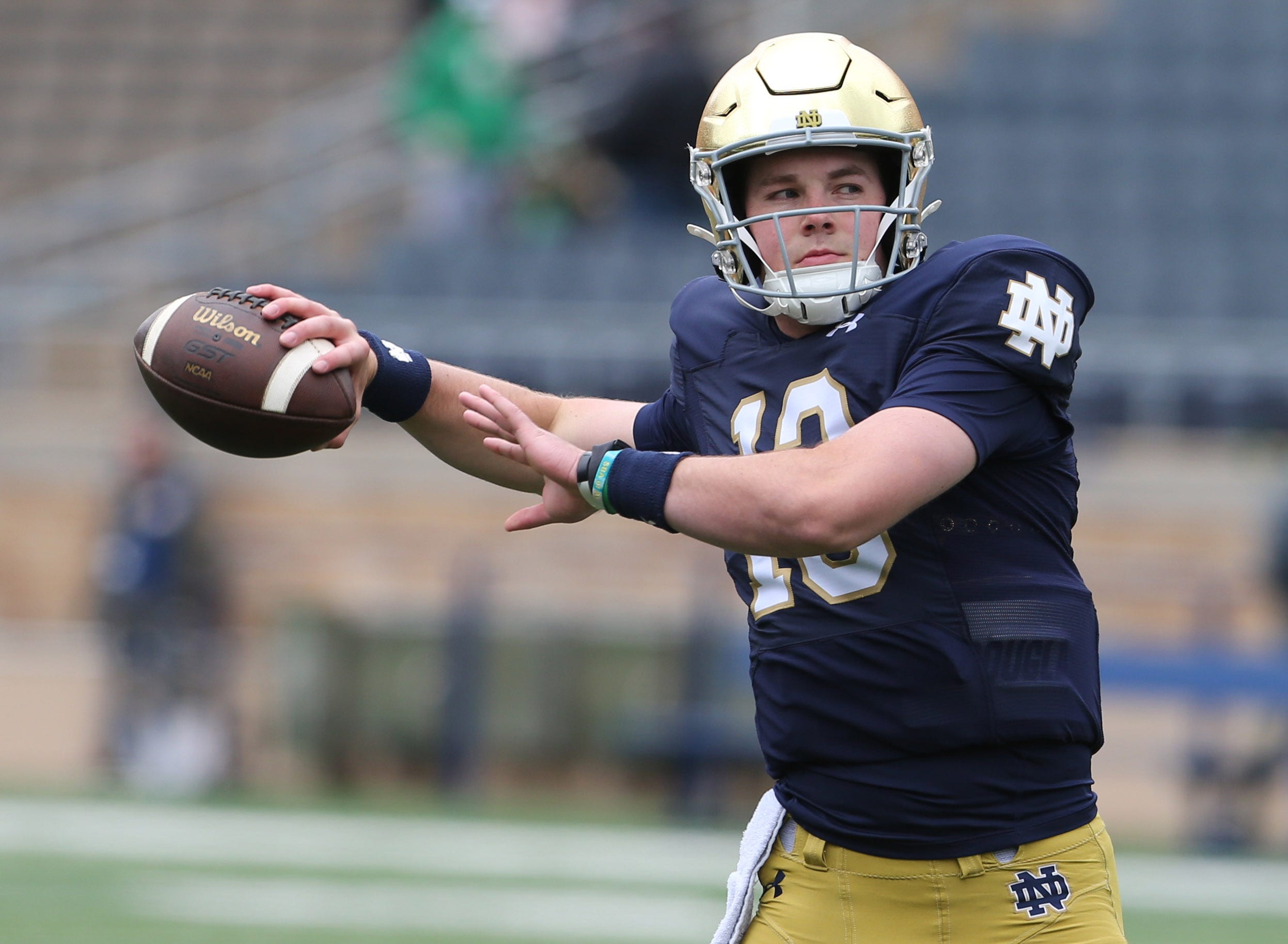 Notre Dame quarterback Riley Leonard (13) who is hurt, dresses and throws some pre-game passes with fellow quarterbacks Saturday, April 20, 2024, at the annual Notre Dame Blue-Gold spring football game at Notre Dame Stadium in South Bend.
