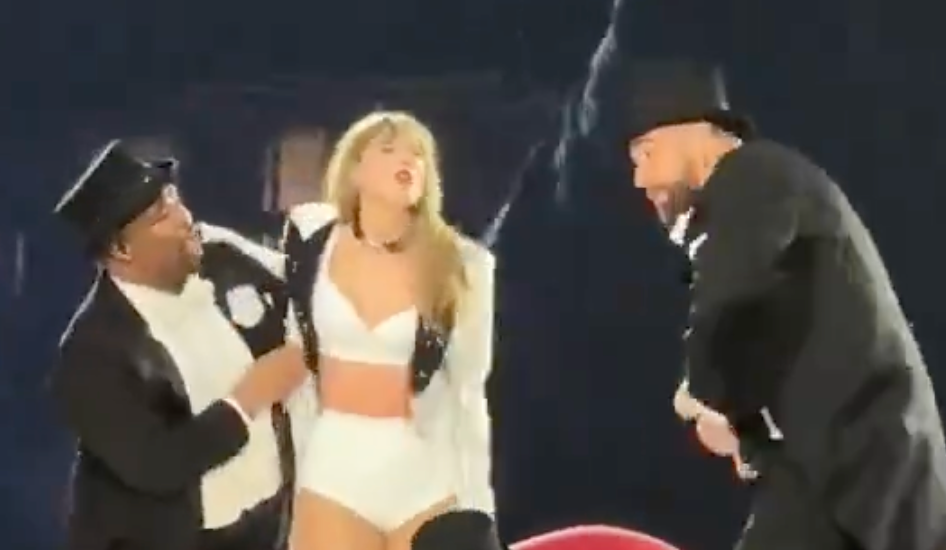 Travis Kelce dances while on stage with Taylor Swift on the third night of her Eras Tour shows at Wembley Stadium